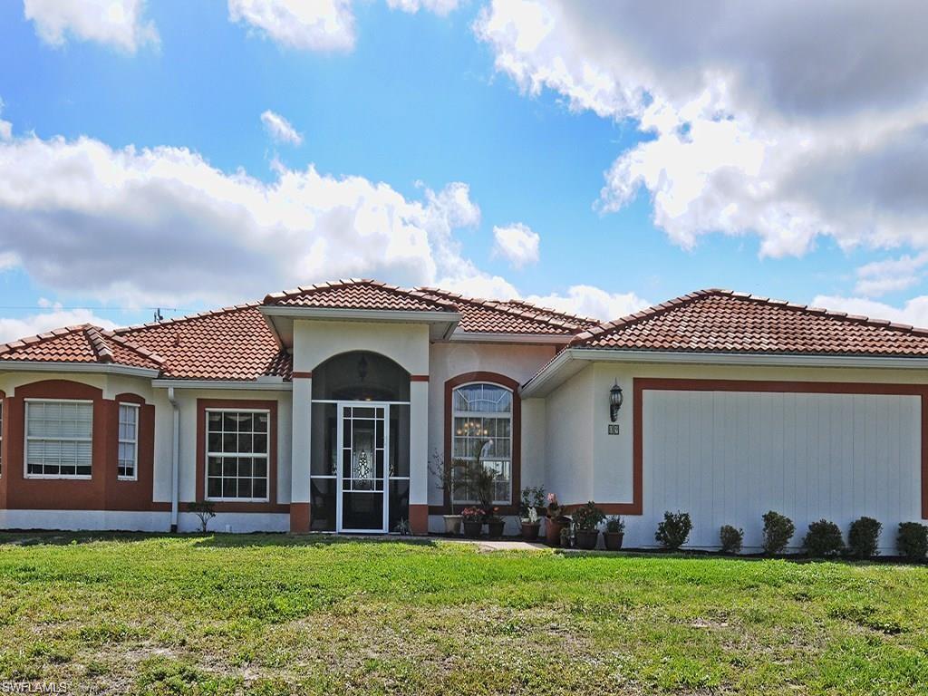 Get your slice of paradise! Beautiful 4 bedroom pool home with tile roof and a  2 car detached garage, Former model home, with plenty of parking. Home has approx 2,900 sq ft of living space under air. This home has lots of extras and upgrades such as granite counters, laminate flooring, a newer tankless hot water heater, jacuzzi tub in master bath, a large media room or man cave, plus much more. large Pool has beautiful decorative fountains. Close to shopping and restaurants. Come take a look and make this your new home. Motivated seller!
