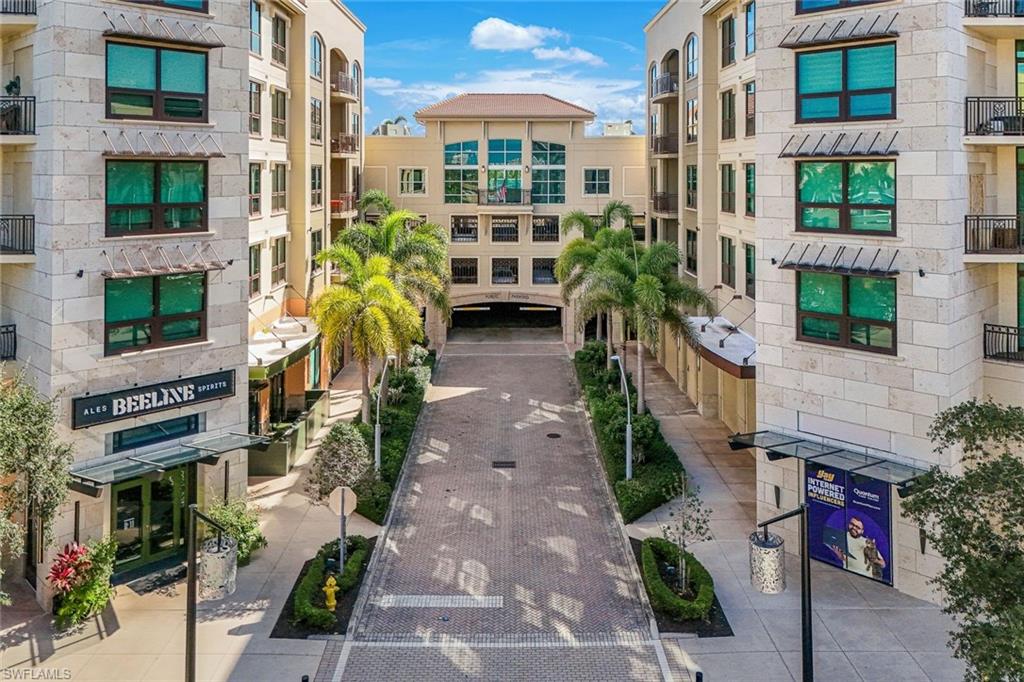 One or more photo(s) has been virtually staged, AI generated or rendered.  This beautifully appointed end-unit residence at the sought-after Strada at Mercato comes with a multi-year tenant in place through March 2027, making it a true turnkey investment with zero setup required. But this one has a second chapter too. Whether you’re a savvy investor looking for immediate cash flow, a future seasonal resident planning ahead, or both — this is the kind of opportunity that rarely comes together so cleanly.

Not all two-bedrooms at Strada are created equal. This sought-after end-unit floor plan offers something the standard residences simply can’t — expanded interior square footage and an oversized balcony that truly lives like an outdoor room. At approximately 1,548 square feet, the additional space is felt the moment you step inside, and the larger balcony becomes your personal perch above it all — equally suited for morning coffee, evening cocktails, or simply soaking in the energy of the Mercato below. Wood flooring carries through the main living areas, with carpeted bedrooms, and the open-concept layout is flooded with natural light from the additional windows only an end unit can offer. It’s the kind of space that feels like home the moment you walk in — which makes it equally easy to lease and equally hard to leave.

The kitchen is styled for both function and impression: gas stove, upgraded granite countertops, elegant cabinetry with tiled backsplash and under-cabinet lighting, a breakfast bar that’s perfect for a quiet morning before a beach day. The living and dining area flows effortlessly from the kitchen, with updated lighting throughout. A dedicated laundry area with washer, dryer, and built-in storage keeps everything tidy. Both oversized bedrooms feature ensuite baths — one with a soaking tub and walk-in shower, the other with a walk-in shower — plus generous storage throughout.

Step outside and the lifestyle sells itself. You’re steps from the Ritz-Carlton Beach Resort, Whole Foods, boutique shopping, upscale dining, a movie theater, Pilates and cycling studios, and day spas — with Downtown Naples just 15 minutes away. Spend your mornings at the rooftop lap pool, your afternoons shopping Mercato, and your evenings at one of the neighborhood’s celebrated restaurants. And when you do bring the whole family — yes, four-legged members welcome — the community’s dedicated dog run means nobody gets left out. When the lease concludes in March 2027, simply step into the life you’ve been building toward — or lease again and let the income continue.

The amenity package is resort-caliber: gated entry with 24/7 security and video monitoring, a rooftop 52-foot lap pool, spa, two outdoor grills, fire pit, fitness center, and a clubhouse with full kitchen. Two assigned garage parking stalls and a climate-controlled storage unit round out the package.

Collect rent while you wait. Then make it yours. Furniture is negotiable. Sold As Is.