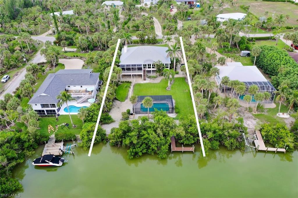 Gulf Access Waterfront Retreat on Sanibel Island – Coastal Living at Its Best Discover the essence of island living in this beautifully appointed 3-bedroom, 2.5-bath, 2,100 sq ft home, ideally located on a direct Gulf access canal in one of Sanibel’s most desirable neighborhoods. With no bridges to open water, a private dock, and a community boat ramp nearby, this is truly a boater’s paradise. Step inside to find a spacious open-concept layout filled with natural light from expansive windows throughout. The warm blend of tile and wood flooring, a wood-burning fireplace, and thoughtfully designed living spaces create the perfect balance of comfort and coastal charm. The oversized dining room is ideal for entertaining, while the glass-enclosed Florida Room under air offers a peaceful retreat with serene canal views. Outdoors, unwind in your private, heated, screen-enclosed pool and enjoy the lush surroundings of a fully fenced yard—perfect for pets, kids, or simply soaking up the sun in privacy. A large bonus space offers flexible options for a home office, gym, media room, or guest suite. Beyond the property, enjoy everything that makes Sanibel extraordinary. You're just minutes from The Sanctuary Golf Club, J.N. “Ding” Darling National Wildlife Refuge, and Sanibel’s world-famous shelling beaches—a haven for nature lovers, golfers, and beachcombers alike. Whether you're seeking a full-time residence, vacation home, or investment property, this rare gem offers the best of waterfront living with easy access to all that makes Sanibel truly special. Your island lifestyle starts here—schedule your private tour today!