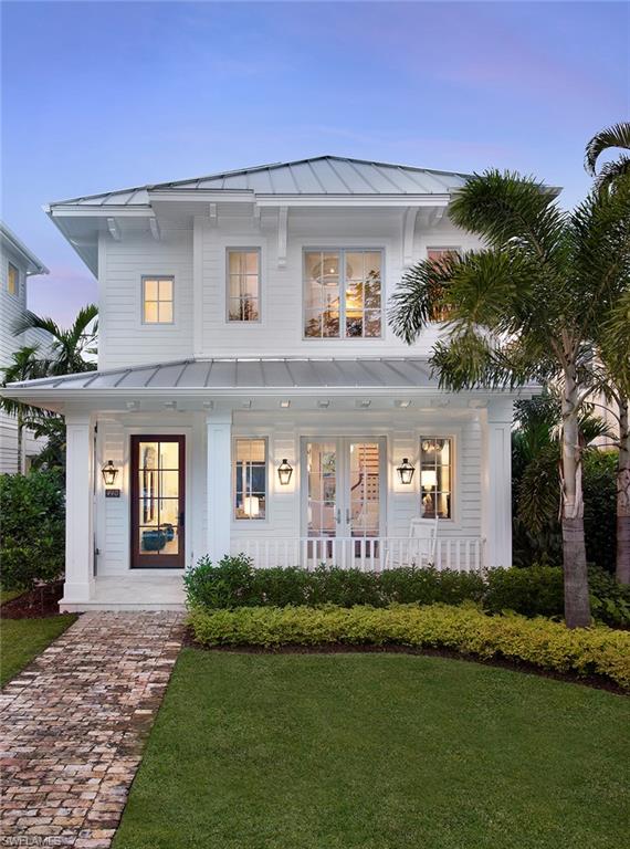 Coastal chic, enticing elegance, and modern luxury meet seamlessly in this designer-decorated, 5-bedroom, 5 ½-bath new construction Old Naples home. Every element is custom and best-in-class, with wide plank Oak flooring, Calcutta and Carrera marble surfaces, Ruffino cabinetry, and appliances from Lacanche, Sub-Zero, Wolf, and Bosch in the gourmet chef’s kitchen. A center courtyard provides a welcoming in-home retreat, featuring a pool and spa as well as an outdoor fireplace and covered seating area. From the center island kitchen through the expansive first level and outdoor courtyard, this home is impeccably primed for entertaining in the finest style, but also tends to your every daily comfort. You’ll fall in love with the incredible natural light throughout the residence, filled with welcoming spaces and little details you’ll continue discovering and appreciating long after unpacking your bags. A house you’ll love to call home, offered perfectly turn-key, and sure to generate oohs and aahs from all your guests and visitors. All of this and the absolute tops in location, too, in the heart of Old Naples and just steps to award-winning beaches, shopping, and dining.
