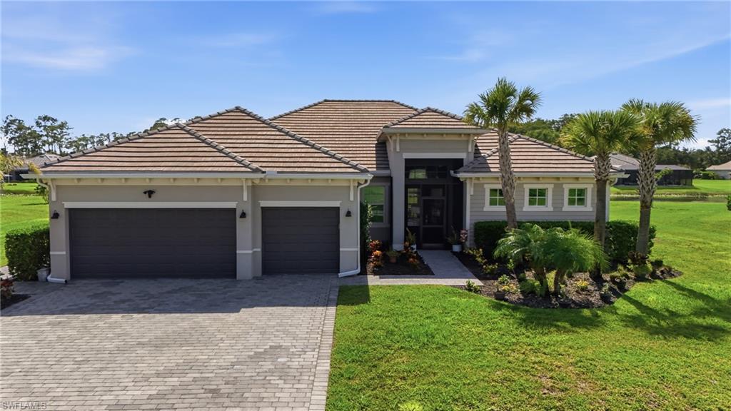 Experience modern Florida living in this beautifully designed single-family home located in the sought-after community of Serengeti in Alva. The sleek, contemporary design is complemented by an open-concept floor plan and tray ceilings that enhance the home's spacious feel. The stylish kitchen is the heart of the home, featuring an oversized island with sink, abundant cabinet storage, stainless steel appliances, and ample space for entertaining and everyday living.

The primary suite offers direct access to the lanai and a spa-inspired bathroom complete with dual vanities, a large tiled walk-in shower, and plenty of space to unwind. Step outside to the expansive lanai finished with decorative pavers, perfect for relaxing or hosting guests. The spacious, level backyard overlooks a tranquil lake, providing a picturesque backdrop and endless possibilities to create the backyard oasis of your dreams! Enjoy peaceful surroundings while still being conveniently located near shopping, dining, recreation, and all that Southwest Florida has to offer.

One photo is an artist's conceptual rendering to help visualize the backyard's potential. The image is for inspiration only and does not represent the property's current condition or any improvements included in the sale.