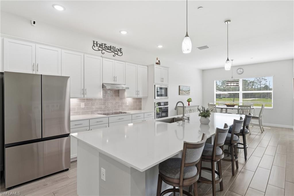 EX   
Experience modern Florida living in this beautifully designed single-family home located in the sought-after community of Serengeti in Alva. The sleek, contemporary design is complemented by an open-concept floor plan and tray ceilings that enhance the home's spacious feel. The stylish kitchen is the heart of the home, featuring an oversized island with sink, abundant cabinet storage, stainless steel appliances, and ample space for entertaining and everyday living.

The primary suite offers direct access to the lanai and a spa-inspired bathroom complete with dual vanities, a large tiled walk-in shower, and plenty of space to unwind. Step outside to the expansive lanai finished with decorative pavers, perfect for relaxing or hosting guests. The spacious, level backyard overlooks a tranquil lake, providing a picturesque backdrop and endless possibilities to create the backyard oasis of your dreams! Enjoy peaceful surroundings while still being conveniently located near shopping, dining, recreation, and all that Southwest Florida has to offer.