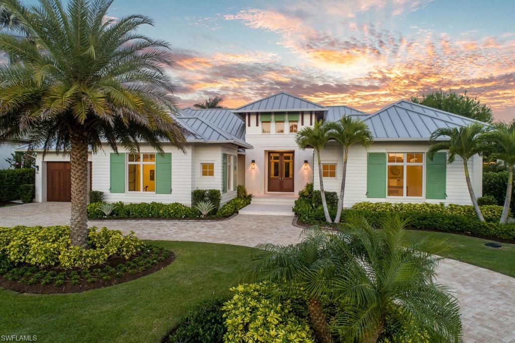H.14344 -With a classic coastal aesthetic and luxurious modern finishes, this home perfectly captures spirit of the Naples experience. Designed by the world-renowned John Cooney of Stofft Cooney Architects, this spacious single level floorplan is an ideal setting for warm winter getaways or year round living.  The highly coveted eastern exposure fills this home with light in the morning and leaves the expansive outdoor living space and summer kitchen comfortably shaded in the afternoons. The home’s interior is highlighted by: a gourmet chef’s kitchen with Wolf Sub-Zero appliances and a double island, an expansive open concept great room, Control-4 automation and lighting system, DuChateau oak floors throughout, a 500 bottle wine room, 4 guest suites, and a generous master suite with his and hers bathrooms.  Large sliders and charming French doors open to the equally well appointed outdoor space which includes: a gas fireplace, Sentinel electric screens and shutters, and a Cypress wood ceiling. Centrally located on one of the area’s most distinguished streets; Venetian Village, Downtown Naples, and the Moorings private beach park are all moments away.