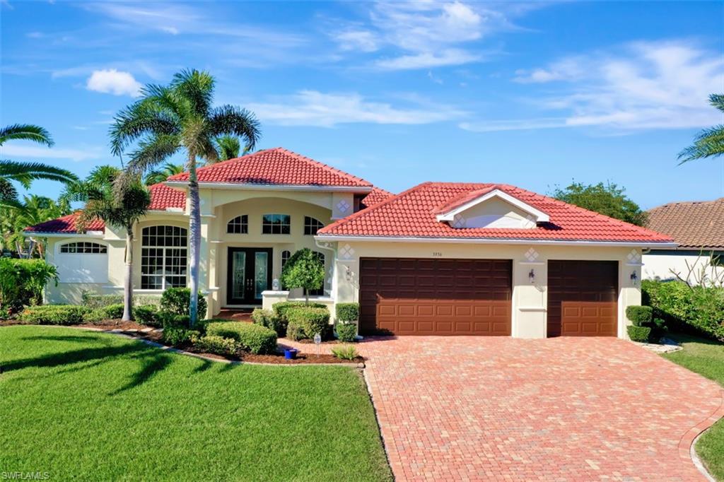 Impeccable gulf access home offers best of everything in SWFL waterfront living! Start with desirable West exp. across a sparkling 175’ wide canal & oversized lot. Lush tropical landscaping, 3 car garage, paver drive & walkways, tile roof, fountain, & striking glass double front entry doors. Inside you’ll find a welcoming foyer, formal LR & dining, home office/den with built-ins, 3 BR, 2 ½ Baths, & bright, spacious family room w/ custom entertainment center. Kitchen highlights include custom wood cabinets, luxurious marble countertops, farmhouse sink, stainless appl, gas cooktop, double ovens, & center island w/ prep-sink. Lg master suite features closets w/ built-ins incl. ironing board, huge master bath with granite tops, walk-in shower and soaking tub.  Extra upgrades inside include crown molding, plantation shutters, wood floors, tray ceilings & French doors. Outside find a pavered, tiered pool deck/lanai w/ outdoor kitchen, multiple sitting areas, a swing, gorgeous heated pool & spa. With a maintenance free dock, 10k boat lift & kayak launch, what more could you want! How about solar photovoltaic panels for low electric bills, impact doors & windows plus roll-downs for lanai.