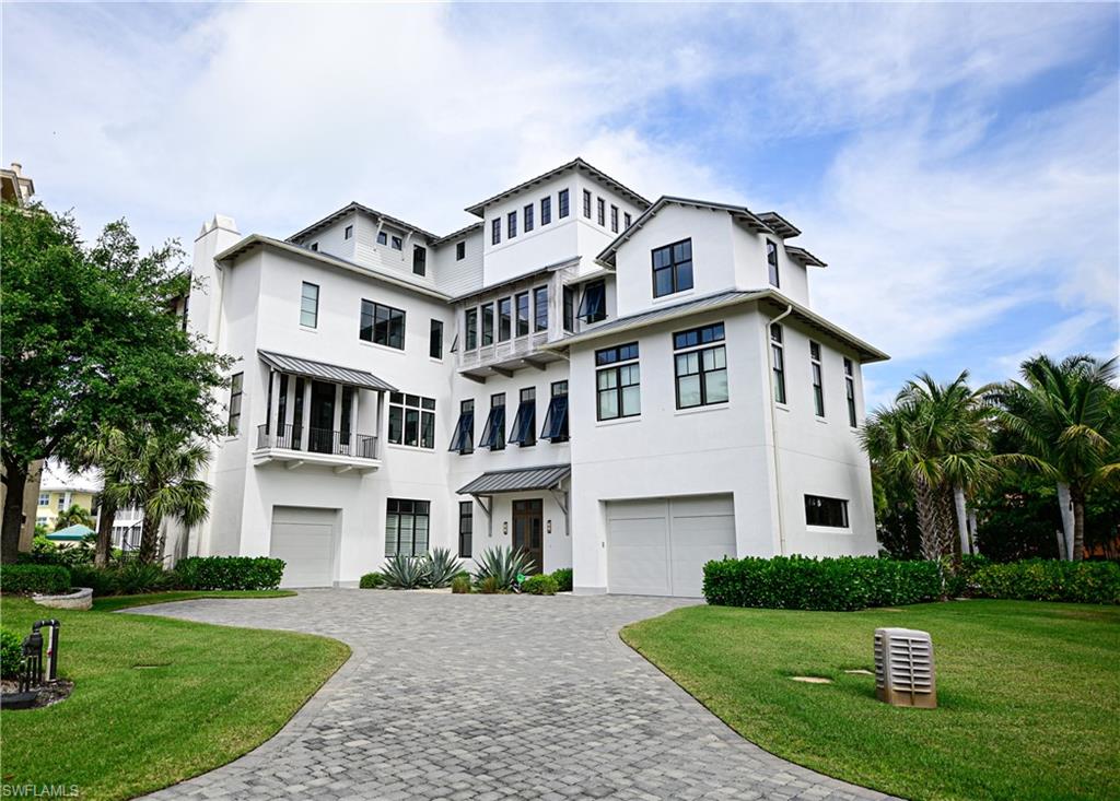 Presenting an as new 2015 gulf front custom home on Barefoot Beach. This Elegant beach property offers a fresh, urban coastal sophistication. Finest materials used including all concrete structure, Andersen Architectural Series Coastal Windows, Authentic Oiled Cypress rafter tails and wood accents, BioLime superior limestone stucco, top floor turf sun deck, fire pit lounge, dedicated brick beach walk, heated beach garden pool, expansive landscaped beach front grounds.  The 4 level home with clean style lines offers generous room dimensions throughout plus 5 suites, media/flex guest room, office, top level gulf flex room, beach entertaining room and 7 total baths.   Entry doors open to a grand foyer with nickel gap wood work, atrium with grand staircase, private elevator, DeGuilio kitchen with Wolf appliances, soapstone and quartz counters, Toto faucets and fixtures fully custom vanities, Dornbracht fixtures in Master, & Tadelakt walls in bathrooms. Includes 24 hour patrolled security, clubhouse with fitness, tennis, and pickle ball. Optional full service Club at Barefoot Beach. Boat dock is available for separate purchase.