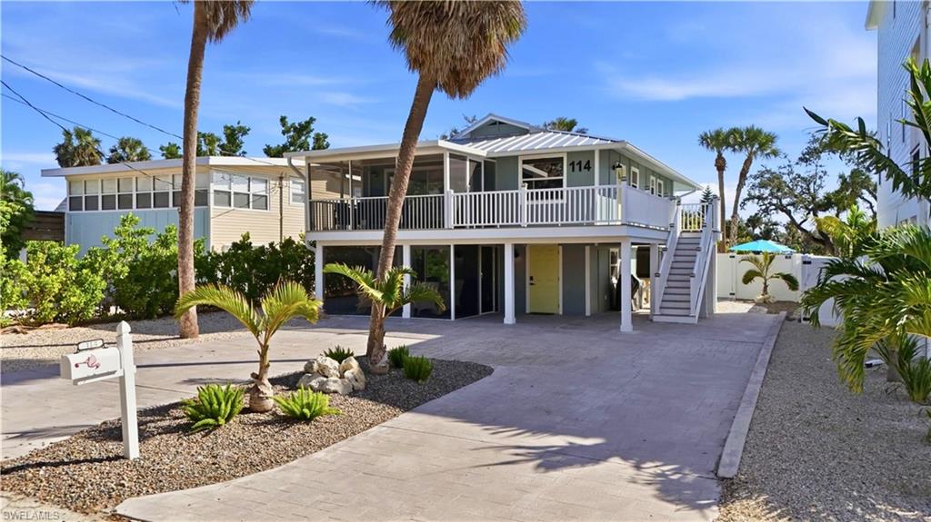 High-Performance DUPLEX! Investor opportunity with DIRECT BEACH ACCESS and Potential RENTAL INCOME exceeding $100,000 annually based on previous rental performance. Located in Fort Myers Beach's desirable WEEKLY Rental Zone, this turnkey Duplex is within walking distance of Margaritaville, Times Square, beach bars, restaurants, shopping, and entertainment.

This coastal cottage retreat features a brand-new heated saltwater pool and two beautifully updated living spaces. The upper residence offers 2 bedrooms, 2 baths, an open-concept living area, redesigned kitchen, screened lanai, and a newly constructed composite deck perfect for relaxing or entertaining. The lower residence features 1 bedroom, 1 bath, a fully renovated kitchen with center island, open living and dining areas, and a screened lanai.
The private backyard oasis is surrounded by tropical landscaping, paver decking, and low-maintenance vinyl fencing, creating the perfect setting for owners and guests to enjoy the island lifestyle.

Whether you're seeking a HIGH-Performing vacation rental, a seasonal getaway, or a personal beach retreat with income-producing potential, this property offers an exceptional combination of location, lifestyle, and investment opportunity just steps from the Gulf of Mexico. *Rental History & Proformas available upon request.