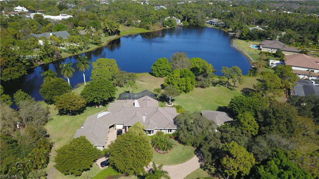 Beautiful 2-acre waterfront estate with guest house, in one of the most exclusive sought-after neighborhoods in the heart of Naples. Resort-style life is complete with a spacious screened lanai, pool, and waterfall. Beyond are lush grounds including a built-in fire pit overlooking wonderfully serene views of one of the biggest lakes in Pine Ridge Estates.
This home has many ways to live with its flexible floor plan including a mother-in-law suite with private entrance. It has been recently renovated and can be move-in ready or can be reimagined with the opportunity to live in the guest house while work is being done.
Enjoy your private paradise then hit the town a short drive from your front door and catch nationally acclaimed entertainers at Artis-Naples, sunsets at the beach, or dining at one of the great restaurants Naples has to offer.
A great value considering its prime lakefront location within Pine Ridge Estates ranked “best neighborhood in America” in 2018 by a real estate research firm comparing over 10,000 neighborhoods.