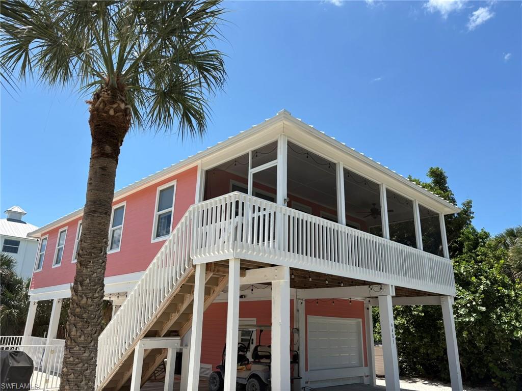 Great Opportunity! Beautiful Island Beach Home now available! Turnkey, Stilt, Beach House with a FANTASTIC South - Gulf Side - Island Location and Situated on a Prime High and Dry Lot with Tropical Views. Easy Beach Access - Located in the Captiva Dunes Neighborhood and just a Very Short Walk or a Golf Cart Drive to the Wide, Sugar Sand, “Sunset Beach” known for Unbelievable Sunsets, Fishing, Shelling, Swimming, and Sand Bar(s). Bright and Open Great Room Floor Plan with Gorgeous Green Tropical Views! Two Bedrooms, One and a Half Baths. Turnkey Furnished with Lovely Furnishings, Fixtures, Window Coverings etc. Nice Kitchen with Long Breakfast Bar, Courian Countertops, Recess Lighting, All Appliances in Place and a Gas Range! Welcoming Main Bedroom with Large Closet. Main Bath with Hallway Access, Large Tiled Shower and Vanity with Courian Countertop. Current Half Bath with Wash Sink, Plenty of Built in Cabinetry and Countertops, and Full Sized Stacked Washer and Dryer optional Second Full Bath Set Up if Desired. Fabulous, Large, Inground, Aluminum Fenced, Salt Water Heated Pool with Built In Seating Shelves and Large Brick Paver Decking Surround. Plenty of Under House Area Entertaining Areas. Ready for your Outdoor Bath, Shower and/or Changing Enclosure and Outdoor Bar and/or Kitchen. Other Features Include: All Young/Recent - 2024 White Metal Standing Seem Roof, 2023 HVAC, 2025 Exterior Paint, and 2023 Whole House Reverse Osmosis System! Hurricane Impact Windows and Doors and Hardie-board Siding! Tile Throughout. Expansive and Desirable, Front Screened Balcony with Sliders, Fan, Recess Lighting and Tropical Landscape Views! Attached Ground Level Garage. Great Property Layout with Large Left Side Yard to Enjoy in Addition to the Pool Area. Thoughtfully placed Back Yard Septic. This is a Private Pool Home with No Memberships or HOA Fees to Assume! This Home has a Great Rental History with Many Repeat Annual Renters and it is Professionally Managed. This Island Beach House also has Over 150 - ALL Five Star Reviews. Additional Prime Surrounding Lots may be available to the buyer(s) of this home for purchase. They are located across from and to the left of the property. This Home is Simply A Must See!