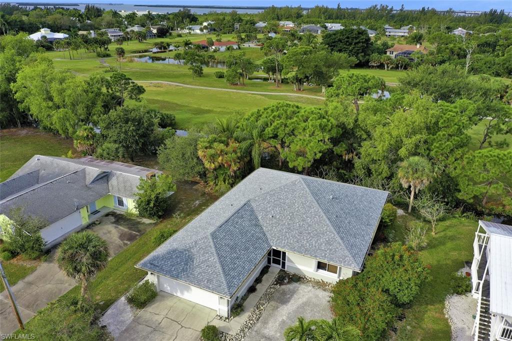 Relax and Enjoy the Breeze off the Golf Course form this Turn-key Furnished Bokeelia Home on the 16th hole of the Alden Pines Golf Course. Move-in-Ready with updated kitchen, baths, and new roof in 2019. The 3-bedroom, 3-bath floor plan also has an over-sized screened lanai. Accordion Shutters for the lanai and windows make closing up for the summer easy. Located on a peaceful and quiet street less than a mile from the Marina for a day of boating fun in the sun.