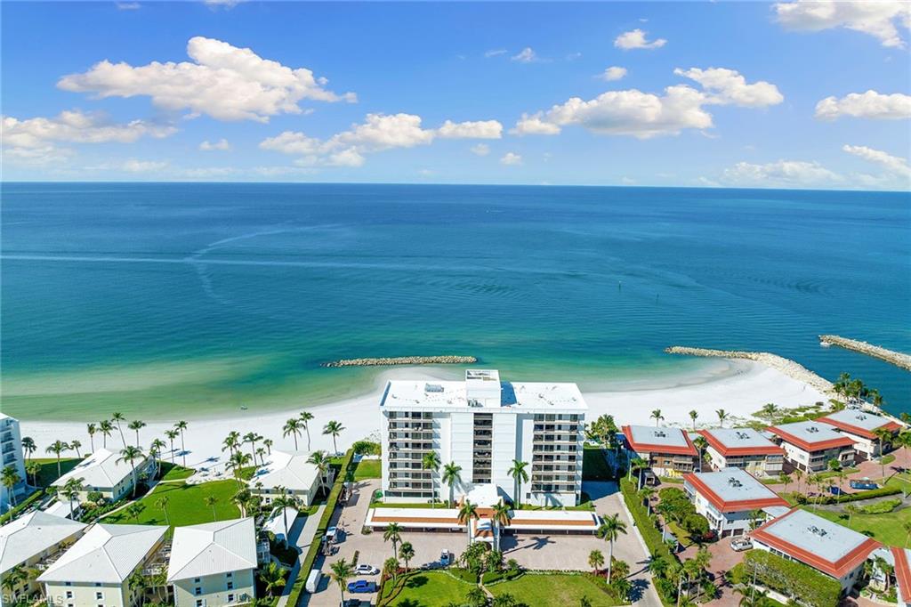 Stunning direct Gulf views and effortless coastal living come together in this beautifully renovated two-bedroom, two-bath residence at Gulf View Beach Club. Ideally positioned to capture sweeping water views, the light-filled interior opens to an expansive screened and covered balcony overlooking the Gulf, an ideal setting for morning coffee or evening sunsets. Updated in 2021 with a refined coastal aesthetic, the residence features a thoughtfully designed open layout enhanced by light finishes and clean lines throughout. The kitchen flows seamlessly into the main living area, creating an inviting space for everyday living and entertaining. A built-in desk area offers a functional workspace, while the in-residence laundry adds convenience. Recent improvements include a new air conditioner in 2025. Includes assigned parking and dedicated storage space. Gulf View Beach Club has one of the desirable beachfront locations south of Doctor’s Pass, and is an intimate building with just 32 residences, offering direct beach access, a beachfront pool and patio, social room, fitness center, on-site manager, individual storage rooms, paddleboard and kayak racks. Just minutes from luxury shopping and fine dining of downtown Naples, this is beachfront living at its finest.
