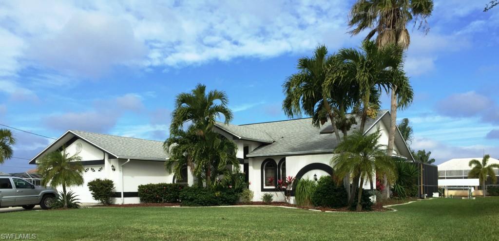 REDUCED $10,000!  Excellent VALUE! Least Expensive Gulf Access Pool Home for it's size in Unit 74 and Assessments are Paid!  Great opportunity to own a 3BR/3Bath GULF Access POOL home with over 2000 sq ft in sought after SW Cape neighborhood near Surfside Blvd.  Home needs some updating but has lots of natural lighting, architectural detail, charm, and an appealing layout.  Arched windows and doorways, vaulted and tray ceilings, and overhead plant shelves give this home lots of character.  Separate living and family room areas offer an open feel yet create privacy.  Large master suite with soaking tub and separate shower.  Relax outside on the nicely landscaped screened lanai, take a dip in the heated pool, or enjoy the view from your concrete boat dock.