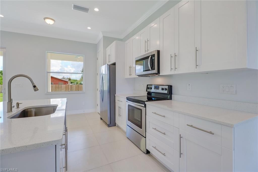 Looking for a home with high quality construction at an affordable price? Then look no further! Brand New Construction in a great neighborhood of Bonita! Best of all…No fees No restrictions!  As you enter you will notice the attention to detail. Open floor plan with plenty of light throughout this home that will make you fall in love! 10’ ceilings,  8’ doors, tile throughout, a beautiful kitchen with an island, soft close cabinets, quartz countertops, stainless steel appliances and best of all, your own bar entertainment area with a wine cooler! The master bedroom will drive you crazy!  It features trey ceiling, dual walk-in closets, and a large master bath with Quartz countertops and a beautiful shower with custom tile. This home is ready with Impact resistant windows and doors.  My favorite feature is the second master with it's own wet bar which has a separate entrance on the side making it a perfect in-law suite or room for a family member. This home offers over 2,000sqft under air, 4 bedrooms, 3 baths with 2 master suites. Close to everything Bonita has to offer! Minutes to Bonita Beach, 15 mins to Coconut Point, and best of all, close to I-75!