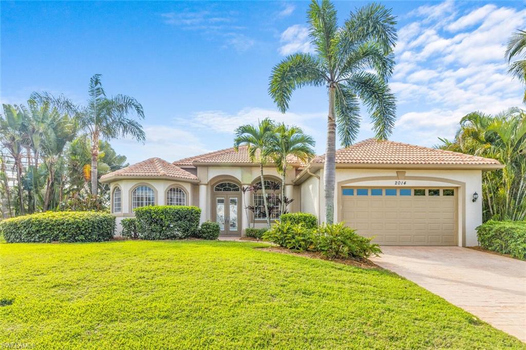 Prepared to be wowed!  Gorgeous views looking straight up the wide, long canal over the pool edge is absolutely breathtaking! This 1936 square foot single family home has 3 bedrooms and 2.0 bathrooms that is being sold turnkey (minus seller exclusions), tile roof, boat lift/dock and a 2 car garage!  Lush landscaping, stately curb appeal, open floor plan, and soaring ceilings-this one won't last!  Beautiful designer touches throughout in this previous builder model! Within a mile to Cape Harbour Marina and a short drive to local airports and beaches, call today for your private showing before its gone!