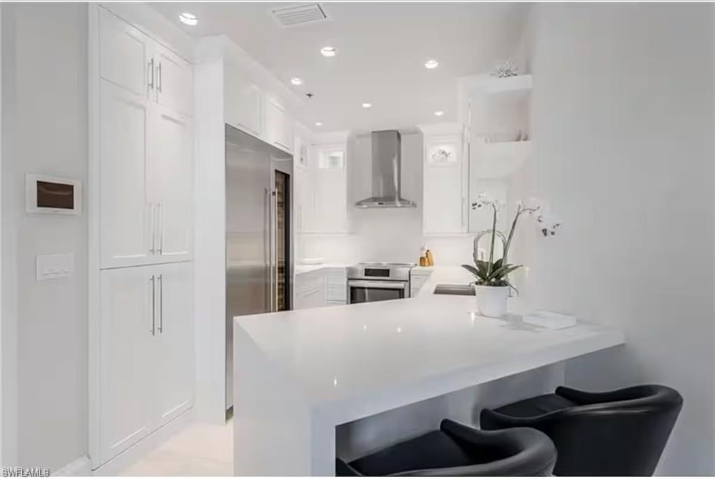 Experience the pinnacle of downtown living at 365 5th Ave S, Unit 307, where the vibrant energy of Naples meets sophisticated coastal elegance. Located right in the heart of the iconic 5th Avenue South district, this residence places world-class dining, high-end boutiques, and sugar-sand beaches just moments from your front door.

In the heart of the action but offering quiet solitude as it does not face 5th Ave South.

Inside, the space feels bright and airy, with an open-concept layout designed for both effortless entertaining and quiet relaxation. Large windows invite an abundance of natural light to dance across the polished finishes, while the private balcony offers a perfect perch to soak in the tropical breeze and the rhythmic hum of the city below. The kitchen is a chef’s dream, featuring sleek cabinetry, premium appliances, and ample counter space for preparing coastal-inspired meals.

The primary suite serves as a serene retreat, complete with a spa-like ensuite bathroom and generous closet space. Every detail in this home has been curated for those who appreciate a lifestyle of convenience and luxury. Whether you're enjoying a sunset dinner at a nearby bistro or spending a slow afternoon by the Gulf, this property offers an unparalleled opportunity to live where everyone else vacations. This is more than just a home; it’s your front-row seat to the very best of Naples.