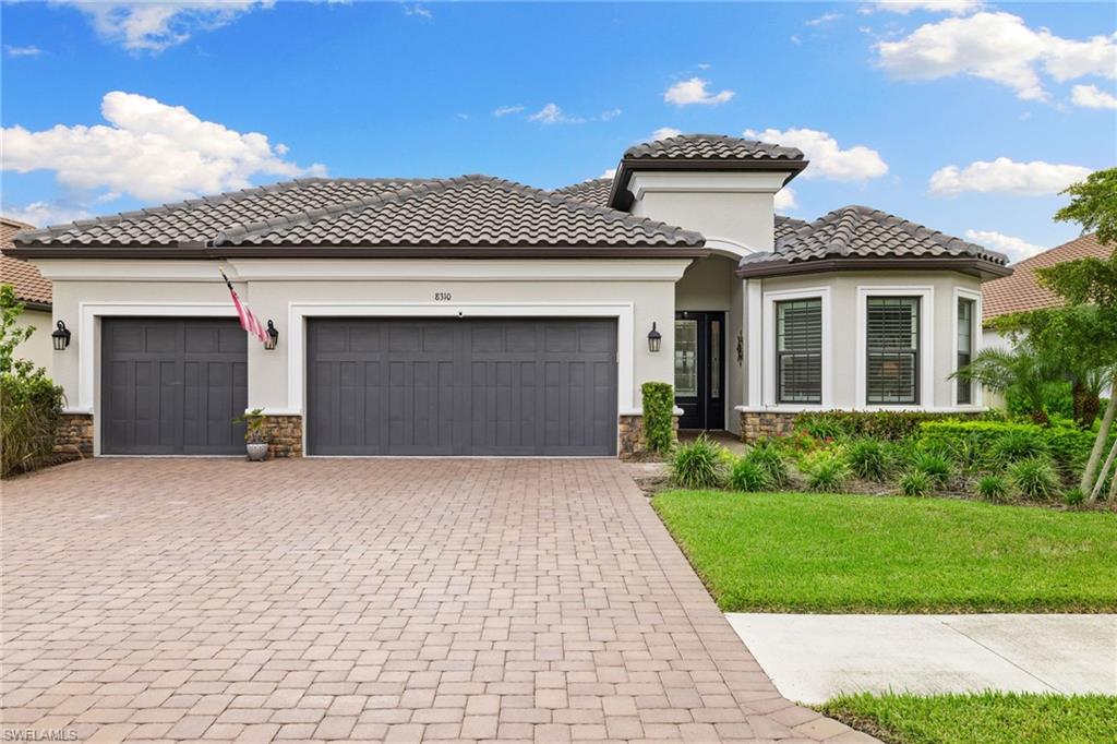 Like new…Lazio model by Taylor Morrison is located in the gated community of the Esplanade at Hacienda Lakes.  Amazing, 3+den, 3 bath, 3 car garage, open concept home is loaded with over $200,000 of upgrades.  From the gourmet kitchen, (GE Monogram appliances, gas cooktop & Cafe Refrigerator), to the amazing extended outdoor lanai space (an additional 890 sq. ft. not under cover), this home has it all.  Impact Resistant windows & doors throughout.  The large custom saltwater pool w/spa, outdoor kitchen & gas fireplace makes it a great place to entertain all your guests as they enjoy the stunning long water view.  Watch the wonderful Florida sunsets from the western facing lanai.  Esplanade at Hacienda Lakes is a very active community with resort style amenities.  A 6,500 sq.ft. clubhouse, fitness rooms & equipment, full-service catering kitchen & multi-purpose activities room.  Plus, a resort style pool with lap lanes, a resistance pool, 4 pickleball courts, tennis court, tot lot & dog park.