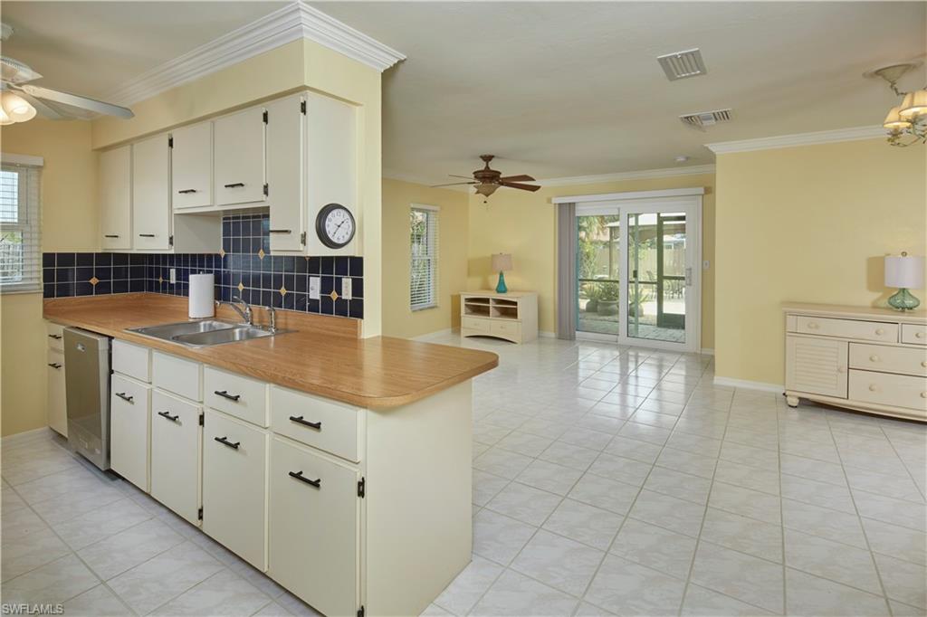 LOCATION, LOCATION, LOCATION! THIS is your opportunity to own a home within MINUTES to the WORLD FAMOUS Barefoot Beach!  Do not miss your chance to turn this three bedroom, two bath house into your DREAM home. This home is so close to the beach but suffered NO damage from Hurricane Ian!  This charming home sits on a large, beautifully landscaped lot.  The low maintenance rear yard is lined with pavers and offers a large shade canopy.  The outdoor space is absolutely magical!  Additional features include a NEW roof in 2019, new AC & ductwork in 2017, new surge protector for the entire home in 2015, hurricane proof windows, sliders & garage door and so much more. There is so very much to love about this home - the open and airy floor plan, the oversized lot, the backyard retreat, the privacy and serenity of the backyard - west of 41, so very close to the beach!! This could very well be the home you have been searching for! This home would also make an excellent rental property as there are no rental restrictions. Downtown Bonita Springs, downtown Naples, shopping, restaurants, and so much more - just around the corner! Also, minutes from the Southwest Florida International Airport!