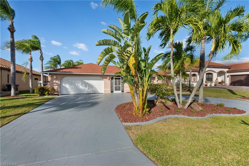 Beautiful DIRECT ACCESS WATERFRONT HOME 3/2/2 with POOL in UNIT 64!! SW section of Cape Coral off of Pelican Blvd. Home is situated at the end of direct gulf access canal, beautiful long canal views and great free form pool. Home features 3 Bedroom 2 Bath with a 2 car garage and circular driveway, living and family rooms, super large updated kitchen with stainless kitchen appliances. Dining nook and dining room area. Four sets of French doors, walk-in closets in all 3 bedrooms, New Carpet with tile throughout rest of house. Looks down Apple Canal, concrete dock in place. Sailboat Access Canal, Only Minutes To The River! Mature Florida Landscaping which includes Mature Queen Palms and landscape curbing with stamped concrete circular driveway.  Over 2,000 Sq. Ft. of home with a HUGE covered and screened lanai overlooking canal and pool. Nice updates through out home, well maintained. Easy to show and sell.