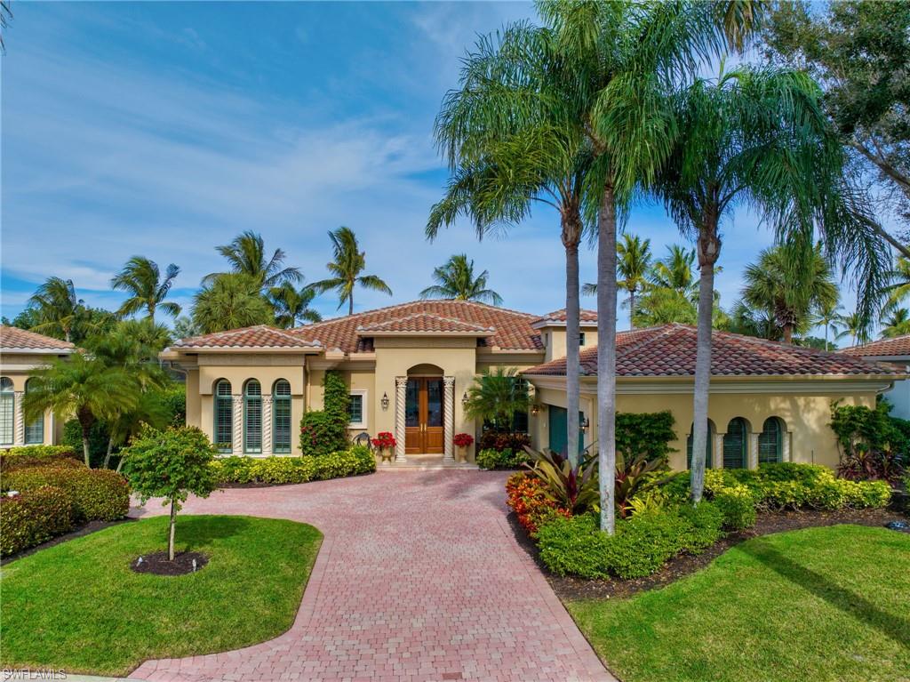 The Bird Sanctuary is located across the lake from this residence, so you will be entertained daily by swooping pelicans, herons, and other Florida wildlife, as you sip coffee on your lanai and another lovely day in paradise unfolds. Enter this gracious home with its voluminous ceilings, abundant crown moldings, and neutral tile flooring in main areas. The primary suite has relaxing views to the pool, lake and the Bird Sanctuary, yet privacy with the landscaping. The gourmet kitchen opens to the breakfast area and family room, with incredible vistas and an abundance of sliding glass doors and windows to let the sunshine spill in. The chef in you will enjoy whipping up dinner in this spacious kitchen with gas range, while the outdoor kitchen grill is steps away. The screened-in lanai and pool area is ideal to dine al fresco, listening to the birds’ conversations across the lake. This home has a 2020 roof, hurricane shutters, a whole-house water filtration system, 2-car garage plus room for a golf cart, and a floor plan that can easily be remastered into a four bedroom/four bath home. Grey Oaks is truly a place to call home, centrally located with world-class amenities. Welcome home!