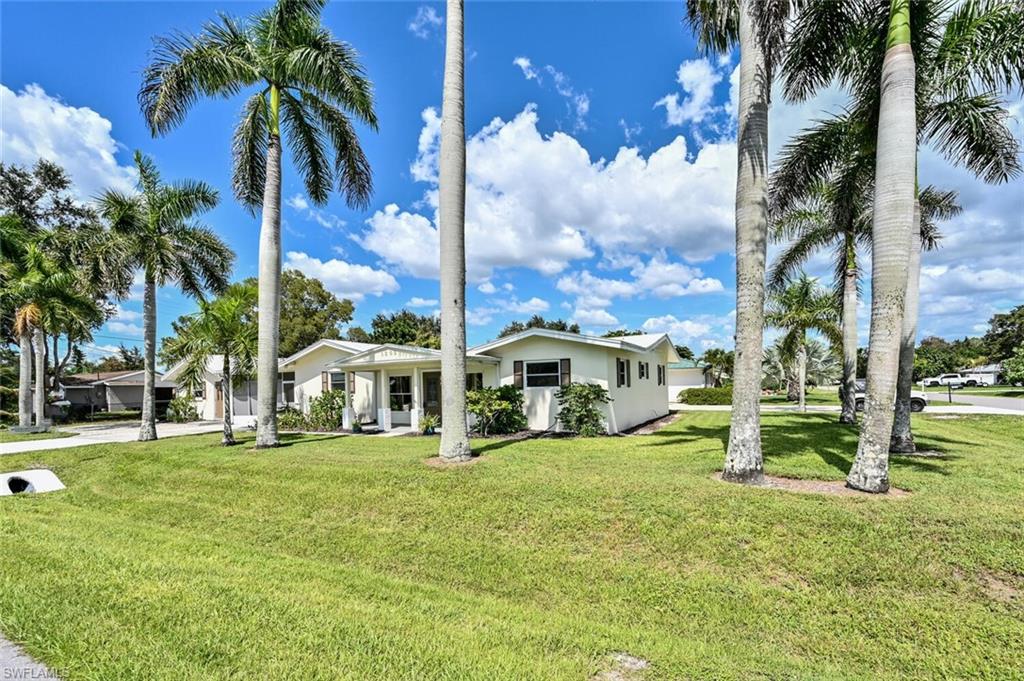 Old Florida style home welcomes you with a charming front porch situated on beautiful (.20ACRE) (8,700 SQ FT) CORNER LOT lined with magnificient Royal Palms. MAIN HOME features 3 bedrooms, 2 baths, Great Room PLUS a 1 Bedroom, 1 Bath GUEST HOUSE. A screened patio and breezeway separate the two homes with a spacious laundry & storage room. Live in the current structure (No storm damage) or BUILD NOW OR LATER NEW HOME PLANS AVAILABLE! Outstanding location bike or walk just 1 mile to the beach, convenient to downtown, shopping & restaurants, A+ School District. Amazing investment opportunity for an investor or end user not to be missed!