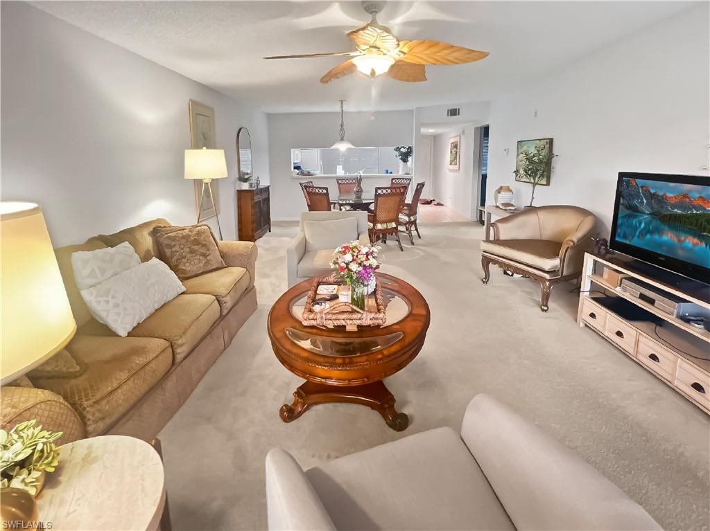 Move right into this beautifully maintained turnkey furnished 2-bedroom, 2-bath first-floor condo overlooking the lush fairways of Royal Wood Golf & Country Club. Enjoy peaceful golf course views from your private screened lanai with the convenience of no stairs and easy first-floor access, perfect for bringing in groceries, luggage, or beach gear with ease.  Inside, you'll find a spacious open floor plan featuring an eat-in kitchen, a combined living and dining area, and the convenience of in-residence laundry. Whether you're looking for a seasonal retreat or full-time residence, this home is ready for you to start enjoying the Naples lifestyle from day one.  Located in desirable Royal Wood Golf & Country Club, residents enjoy bundled golf, an active social calendar, clubhouse dining, tennis, pickleball, fitness center, community pool, and a variety of clubs and activities. Just minutes from downtown Naples, beaches, shopping, dining, and entertainment.