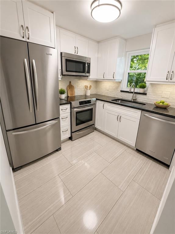 One or more photo(s) has been virtually staged, AI generated or rendered.  Perfectly positioned just minutes from Downtown Naples, this beautifully updated 2-bedroom, 2-bath residence offers the ideal blend of convenience, comfort, and quiet Florida living. Located in a peaceful, well-maintained community, this first-floor corner unit feels like a hidden retreat while still being close to Naples’ world-famous beaches, shopping, dining, and entertainment.

Inside, you’ll find tasteful updates throughout, including hurricane-impact windows and sliders that provide both peace of mind and energy efficiency. Natural light fills the living spaces, creating a bright and inviting atmosphere that instantly feels like home. 

Whether you're looking for a seasonal escape, full-time residence, or investment opportunity, this property offers the Naples lifestyle buyers are searching for — all in an unbeatable location. Come experience why this charming residence stands out from the rest!