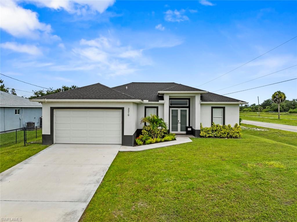 Situated on an oversized 0.50-acre double corner lot in a prime Lehigh Acres location, this exceptional home offers the perfect combination of space, style, and convenience. Ideally located just off Sunshine Blvd. and less than one mile from Lee Blvd., you'll enjoy quick access to shopping, dining, schools, and major roadways.
This thoughtfully designed residence features 3 bedrooms plus a den (or optional 4th bedroom) and 2 full bathrooms with an open, airy layout highlighted by impressive double-height ceilings. Interior upgrades include porcelain tile flooring throughout, elegant quartz countertops, and a spacious primary suite with dual sinks and a beautifully finished walk-in shower.
A standout feature is the garage, complete with an insulated garage door, vinyl flooring, and A/C, offering added comfort and versatility. Situated on a rare 0.50-acre double corner lot, this home combines premium finishes, generous space, and an unbeatable location in one of Lehigh Acres' most desirable areas.