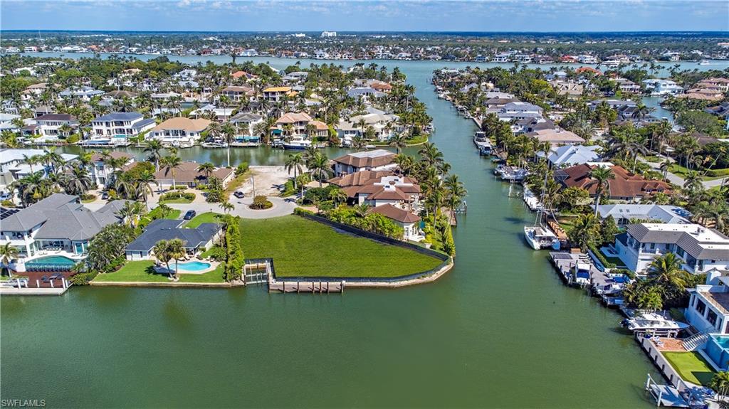 One of the most outstanding waterfront locations in Aqualane Shores is now available to build your Dream home. This property offers spectacular wide water views across Ibis Cove and Egret Channel. There is approximately 176 feet of water frontage, an inset boat slip and desired southwestern exposure.