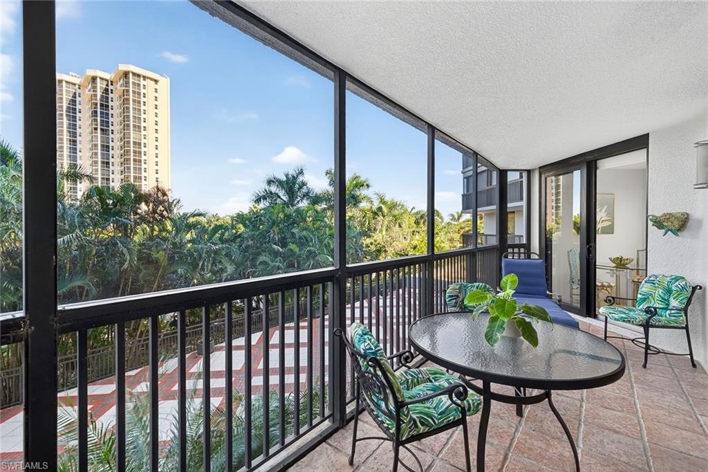 This beautifully designed two-bedroom, 2.5-bath residence offers 1,741 square feet of comfortable living space overlooking tranquil garden views, where soft breezes and prisms of the sunset sky create a serene ambiance. The thoughtfully planned layout features a living area that flows seamlessly onto the lanai, also accessible from the kitchen and guest bedroom, creating an indoor-outdoor living experience. With abundant closet space, a walk-in pantry, stainless steel appliances and impact glass throughout, this home combines peace of mind with timeless comfort. In the desirable Dorchester building in Pelican Bay, residents enjoy an array of exceptional amenities including a fitness center, social room, pool and hot tub, barbecue grills, fire pits, guest suites and under-building parking, plus dedicated storage and a backup generator for added security. Just a short distance away, residents can easily access the South Beach boardwalk leading to Pelican Bay's private beaches, beachfront dining, tennis, pickleball and more. Ideally situated, the Dorchester is only minutes from Artis-Naples, Waterside Shops and Mercato, offering the best of Naples cultural and coastal lifestyle.