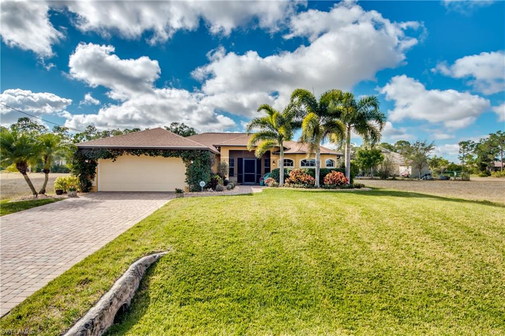 The beauty of this home speaks for itself. Come and visit this gorgeous landscaped yard with pavers leading up to the doorway. The kitchen has stainless steel appliances, granite countertops, and maple wood cabinets.  The large master bath includes a his and her sink with a vanity for her, roman tub and separate shower with 2 shower heads.  Large walk-in his and her closets. Tile throughout entire home, crown molding in master and spare bed room. Back yard has a wooden fence and enough room to fit a pool. Schedule your showing today, this one will not last long!