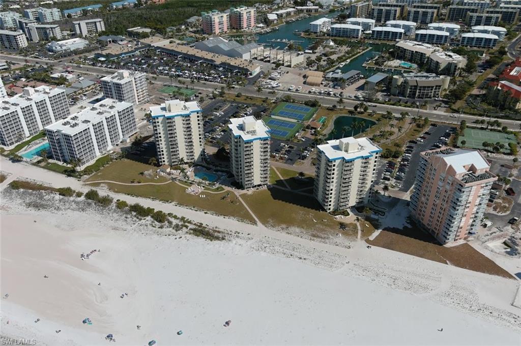 BEACH FRONT -  WEEKLY RENTALS  - AWESOME BEACH & GULF DIRECT VIEWS  - ALL NEW  REMODELED 
Beautiful   inside and  out  awesome beach view  direct walk , steps to the GULF !!!  SUNSETS every night!
RESORT STYLE LIVING , you can live in this condo ,  or rent it out  when you are not using it to make any income!!
Some units making 49K  a year in rents.  This complex has  TENNIS, PICKELBALL , Bocce Ball , shuffle board, bike storage , sunbathing  decks with loungers , pool  has  geo thermal heating ,  easy paved paths to the beach ! 
Walk a 7 mile long island of BEACH FRONT , jog or bike !  Hunt for shells !   AMAZING SUNSETS  from this balcony and property !!!!!