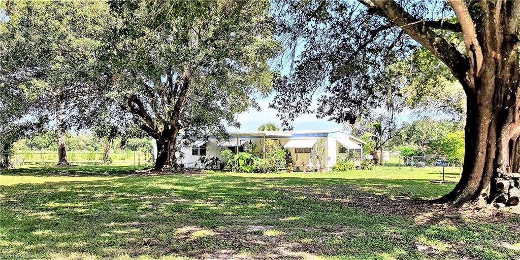 OLD LAKEPORT RD ~ 1.37 ACRE * 2BEDROOMS/2BATHROOMS * Two Screened Rooms out Front * room for Washer/Dryer, Freezer * Rooms to store things or make one into a 3rd Guestroom.  Workshop & Extra Storage area by the Classic Carport.
