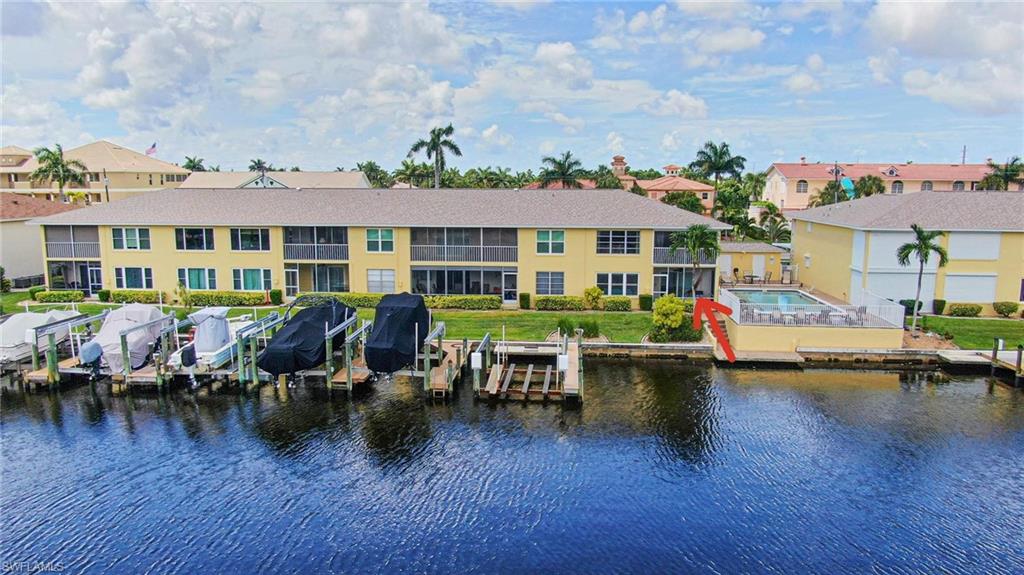 Fully renovated and move-in ready, this stunning first-floor waterfront condo offers direct Gulf access with no bridges and is just steps from the community pool. Boaters will appreciate the wide, deep canal and the quick 5-minute boat ride to the river, providing easy access to open water.

Inside, the bright open floor plan is designed for both everyday living and entertaining. The beautifully updated kitchen features white shaker cabinetry, granite countertops, a farmhouse sink, stainless steel appliances, a wine refrigerator, an oversized island, and a convenient breakfast bar.

The spacious primary suite is a private retreat with a walk-in closet and a beautifully renovated ensuite bathroom showcasing a dual-sink vanity and a large walk-in shower with gorgeous custom tile work. A second bedroom and full guest bathroom provide comfortable accommodations for family and visitors.

Additional highlights include assigned covered parking and a prime first-floor location for easy access. The well-maintained waterfront community has never flooded and has no age restrictions, making it an excellent choice for year-round living or a seasonal residence.  Call today for your private showing!
