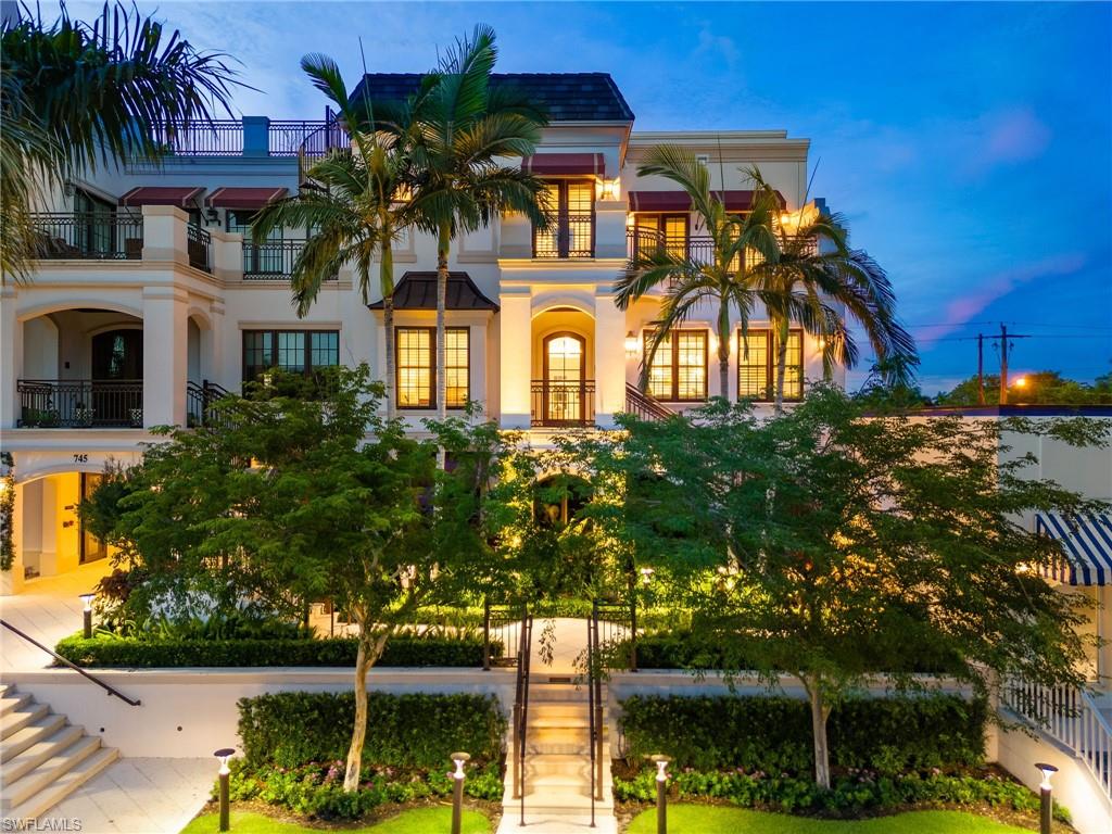 Steps from the boutique shopping and dining of Crayton Cove and offering nearly 5,000 square feet of living space, this 2019-built townhouse is an exceptional option for both part-time and full-time Naples living. Blending the scale of a single-family home with the lock-and-leave convenience of a condominium, Le Petite Trianon features an attached two-car garage, private elevator, refined finishes, and two levels of light-filled living framed by impact glass. The main living level showcases a stunning chef’s kitchen with an oversized center island, double wall ovens, and gas range, all opening seamlessly to the spacious family room with stacked-stone fireplace and an inviting open-air balcony. The upper level is home to the impressive primary suite, designed for ultimate privacy with dual baths, separate vanities, a soaking tub, walk-through shower, and a generous closet—ideal for those who appreciate their own space. This level also includes a convenient laundry room and two ensuite guest bedrooms, each with access to an open-air balcony. Unique in its design and unmatched in lifestyle, this residence is the perfect finishing touch to the quintessential Naples retreat.