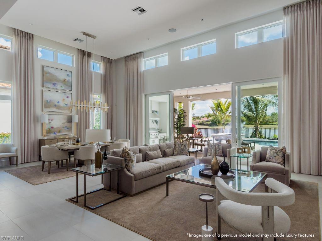 HOME WILL COMMENCE CONSTRUCTION IN OCTOBER WITH ANTICIPATED COMPLETION BY FALL OF 2023. The Martinique home is being built by award winning London Bay Homes in the new North Naples community of Cambridge Park at Orange Blossom. Nestled within this boutique neighborhood of 17 homes, the Martinique exudes the elegance of coastal contemporary architecture. This 4 bedroom 4 bath home boasts a grand great room with soaring 17 foot ceilings and a fabulous gourmet-inspired kitchen featuring Sub Zero and Wolf appliances, custom designer wood cabinetry as well as a large island breakfast bar. The open great room plan includes 10' tall sliding glass doors that lead to a covered area equipped with a fireplace and outdoor kitchen, overlooking the picturesque custom pool and spa. The home's master suite features a luxurious bathroom with freestanding soaking tub, walk-in shower, dual vanities and an oversized walk-in closet. Including the three-car garage and outdoor living and dining areas, the Martinique offers 5,180 total square feet. This home is being sold UNFURNISHED. Minutes to the Ritz Carlton resorts, gulf beaches, Mercato, Venetian Village and fantastic restaurants and shopping!
