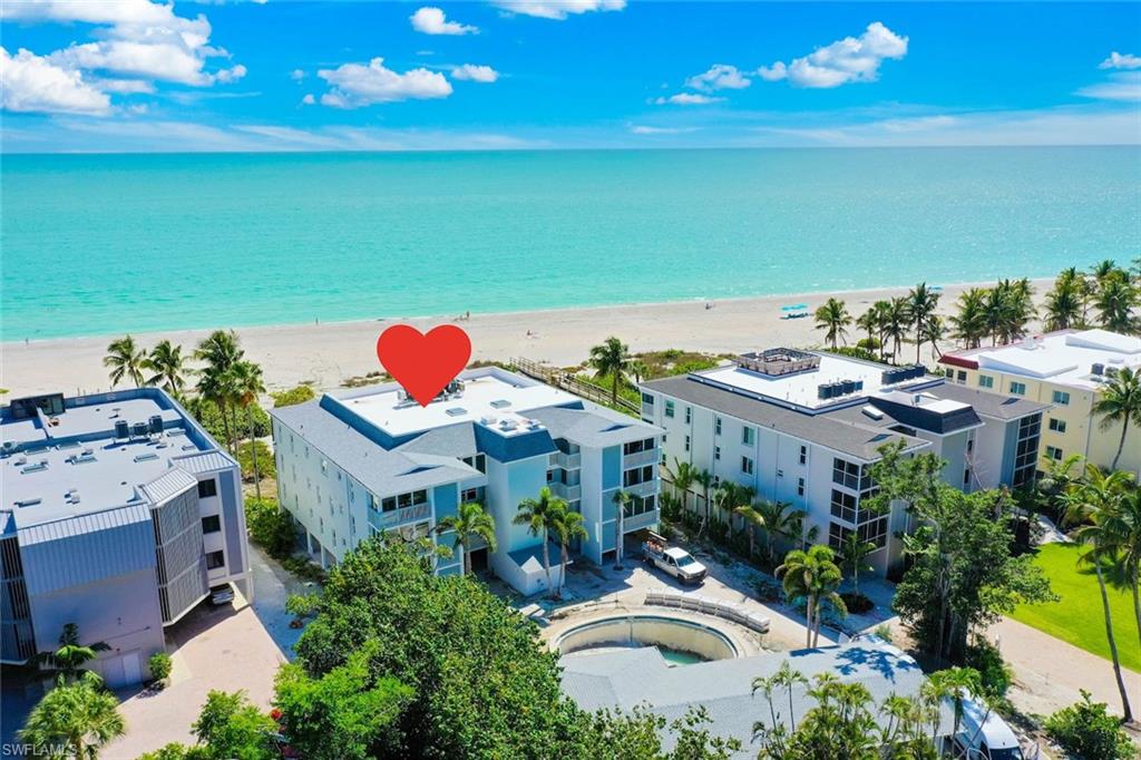 A rare chance to own a fully renovated, Gulf-front residence in one of Sanibel's most exclusive boutique communities. Unit 202 at the iconic Junonia complex has been thoughtfully updated from top to bottom following Hurricane Ian, blending modern coastal finishes with the timeless charm of West Gulf Drive living. Named for the prized shell found on these very shores, Junonia is one of Sanibel's most intimate beachfront communities - just 8 units, sitting directly on the Gulf of Mexico with 200 linear feet of sugar-sand beach. With views of the sparkling Gulf from your screened lanai, this second-floor unit offers the perfect front-row seat to Sanibel's legendary sunsets and world-famous shelling. The renovation thar is nearly completed gives this unit a fresh start - all-new finishes, updated kitchen and baths, impact doors and windows, and quality craftsmanship throughout - while preserving everything that makes Junonia so special. Step outside and you're moments from the Seashell Capital of the World, the J.N. Ding Darling National Wildlife Refuge, top island restaurants, shops, and 25 miles of scenic bike paths. With a two-week minimum rental policy, Junonia remains one of the quieter, more peaceful communities on the island - ideal for personal use or as a coveted rental property. Move-in ready and better than ever - this is Sanibel living, reimagined.