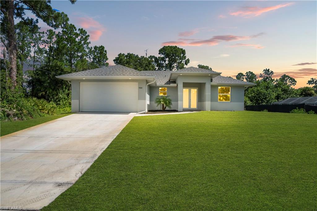 Beautiful new construction featuring 3 bedrooms, 2 bathrooms, and a bright open-concept layout with spacious living and dining areas that seamlessly connect to a modern kitchen with white cabinetry, stainless steel appliances, and a breakfast bar. This home offers elegant tile flooring throughout, tray ceilings with recessed lighting, impact-resistant windows and doors, and abundant natural light. The primary suite includes a walk-in closet and a beautifully designed en-suite bathroom. Located outside of a flood zone and with NO HOA, this property provides peace of mind and the freedom to enjoy your home without association restrictions. Conveniently located near shopping, dining, schools, and major roadways, this move-in-ready home is perfect for families, first-time buyers, or investors.