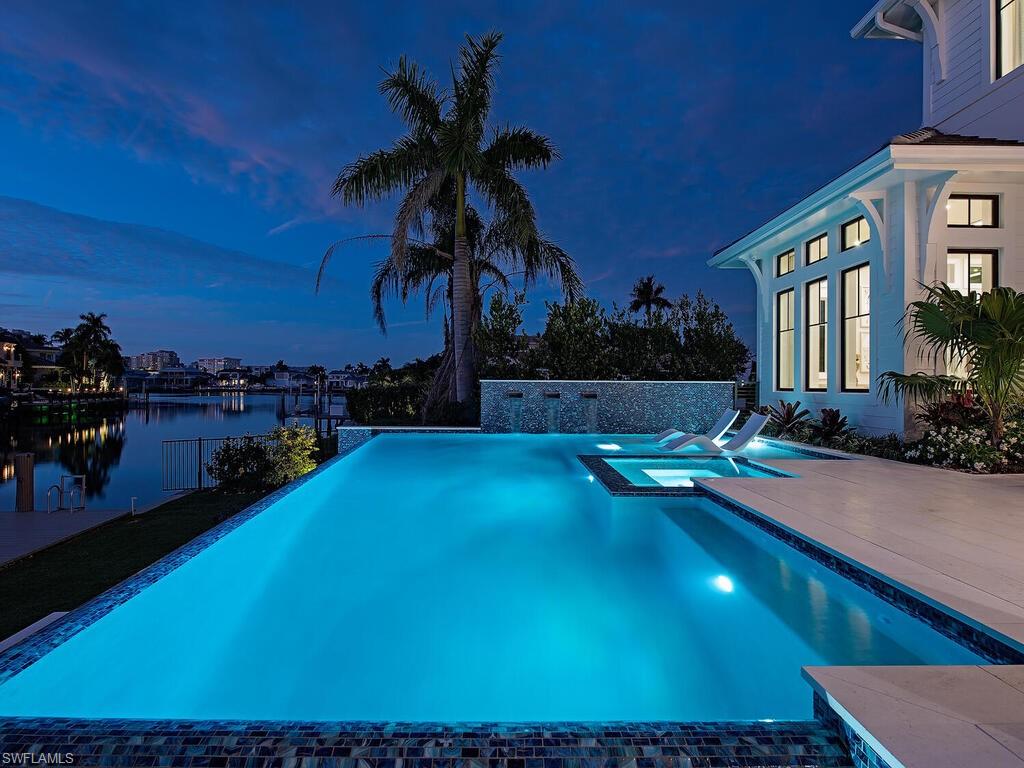 Exquisite New Construction Waterfront Residence within the highly desired Park Shore! Thoughtfully designed by MHK Architecture, conscientiously crafted by T.B. Price Builders, and tastefully appointed by Lisa Ficarra of Ficarra Design Associates, this coastal new construction home lends itself to casual, yet elevated living. The spacious open floor plan features a great room, dining area, elegantly appointed gourmet kitchen, and adjacent caterer’s kitchen. The gracious first floor primary suite boasts a sitting area, spa inspired bath, and morning bar with a well appointed study nearby. Second level living offers four guest ensuites, media loft, additional laundry, wet bar, and generous outdoor balcony. Seamless outdoor living awaits with covered and open-air spaces, featuring a stunning pool and spa area masterfully designed by ALD, Inc. Perfect for relaxation, this exceptional setting offers picturesque views of the Bay in this highly sought-after neighborhood. Park Shore offers private, guarded, gated beach access, and close proximity to Venetian Village and Waterside Shops. Park Shore is centrally located and west of US-41 between Vanderbilt Beach and historic Old Naples. Just a short boat ride to the open waters of the Gulf of Mexico!