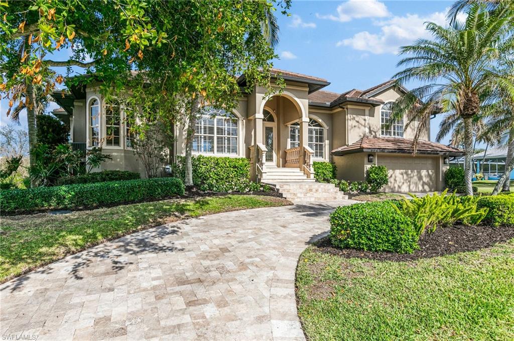 Stunning Waterfront Home in Conners Estates, Vanderbilt Beach.  Tucked away in the exclusive Conners Estates community at Vanderbilt Beach, this beautifully updated 3-bedroom + study, 3.5-bathroom home offers 100 FEET OF WATERFRONT with access to the Gulf via a NEW private dock with a NEW seawall, 13,000 lb boat lift, dock lighting, and fish cleaning station.  Surrounded by lush mangroves, the property provides privacy and scenic views.  The open-concept living area is designed for both relaxation and entertaining, featuring expansive glass walls that connect to an oversized lanai. The remodeled gourmet kitchen boasts Cambria quartz countertops, an island with storage and beverage fridge, Thermador stainless steel appliances, and custom cabinetry with hidden outlets. The luxurious master suite offers serene water views, while an additional guest suite on the main level with a private bath also provides access to the patio. For comfort and privacy, a third large guest suite with two walk-in closets is perfect for visitors on the 2nd level. The pool and spa were recently coated with a Silver Pearl finish, and the dock area was dredged for easy boat access.  Recent improvements include NEW LED pool and spa lights, Aqualink system with WiFi, NEW seawall, boat lift, and fish cleaning station (2021), and NEW pool heater and pump (2024), 250 galleon buried LP tank which heats pool and spa, NEW interior LED lighting, NEW flooring throughout (except den), and freshly painted interiors.  With a newer roof (2018) a private boat dock, and a location just minutes from Naples’ world-renowned shopping, dining, and pristine beaches, this custom waterfront residence offers the best of coastal living. Don’t miss the opportunity to make this exceptional property your own! NO FLOODING inside the home during any any of the storms, including Ian. Owners Flood policy of $1300 per year is transferrable
