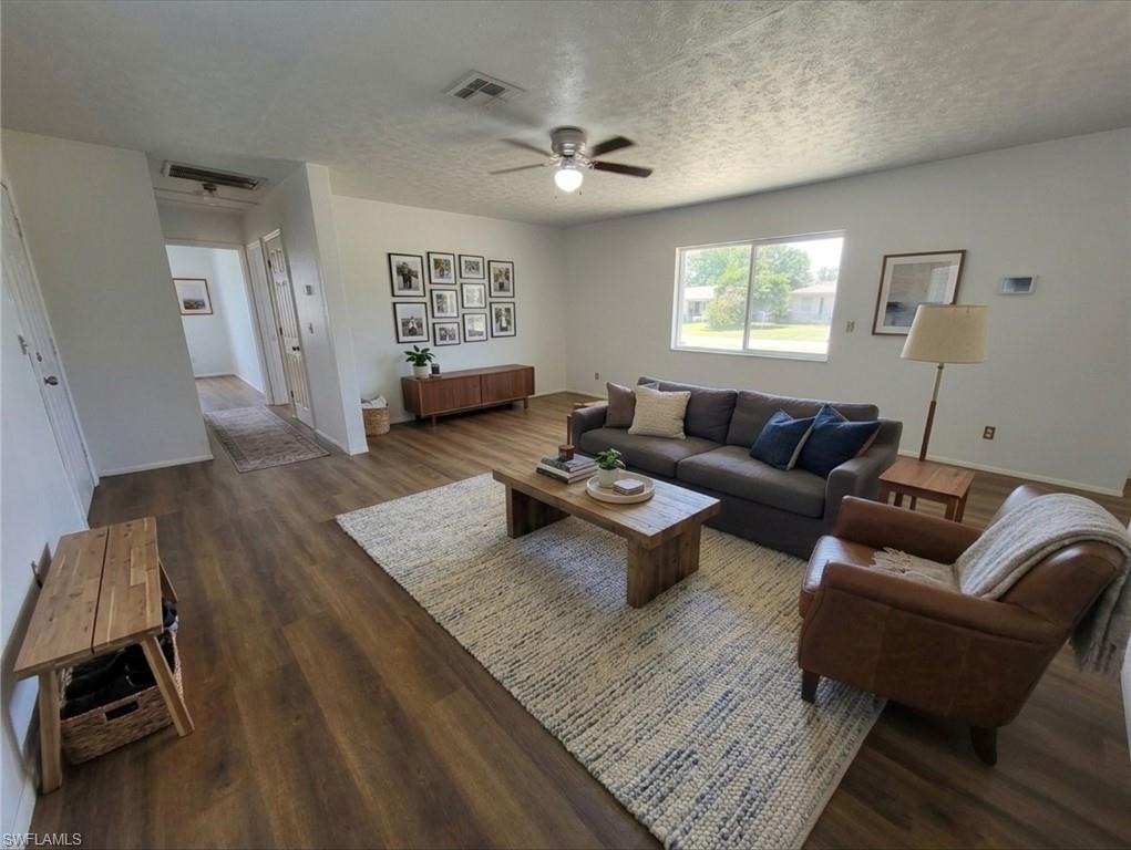 MOVE IN SPECIAL !! 50% off of 1st month's rent! HUGE HOME !! Beautifully remodeled 3-Bed, 2-Bath extra large yard in Lehigh Acres! This stunning home has been recently remodeled, featuring a newer roof, new AC system, a fresh coat of paint inside and out.  Brand new waterproof luxury laminate flooring. The interior boasts modern finishes, updated fixtures, and stylish finishes throughout. This home offers a spacious split bedroom layout, primary bedroom has 2 walk in closets, a modern kitchen, and a beautifully landscaped yard and large laundry room with extra storage. With its fresh updates and move-in-ready condition, it's the perfect place to call home. Don't miss out on this gem—schedule a showing today! Some of the photos have been virtually staged with furniture.