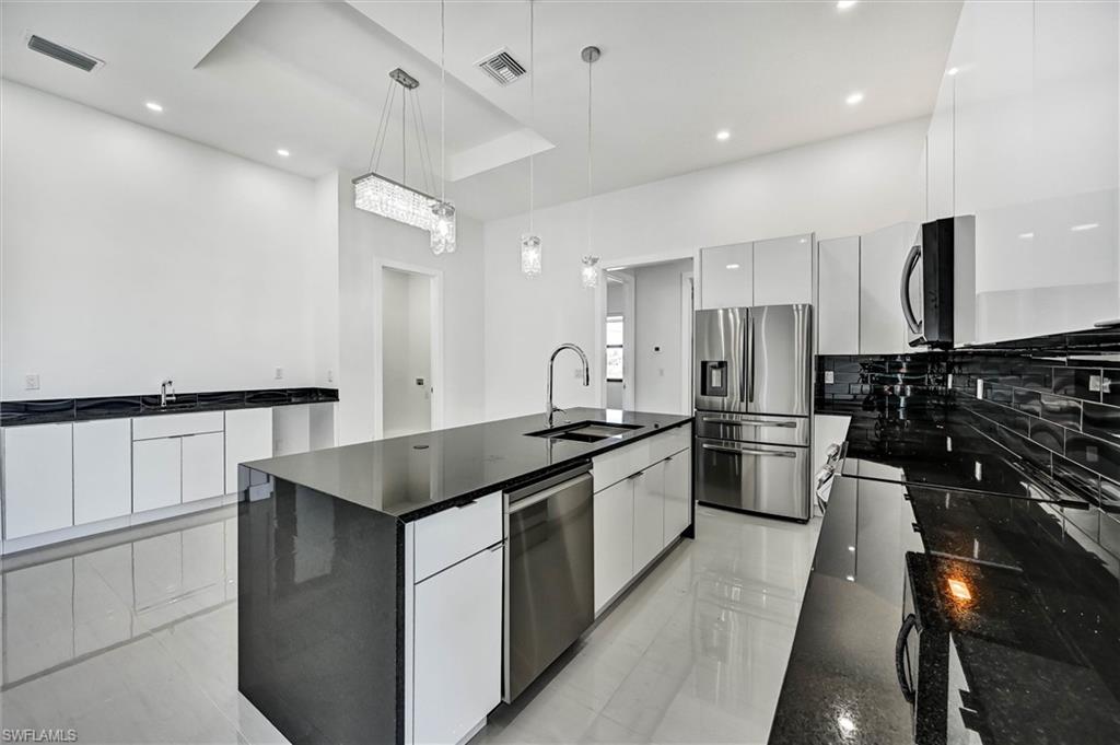 Step inside this immaculate 2023-built home and you will be greeted by soaring ceilings and a bright, open concept that flows effortlessly from the living room to the heart of the home. Beautiful porcelain tile runs throughout the house giving you that clean, coastal feel with low-maintenance luxury. The kitchen is an entertainer’s dream with granite countertops and a large island. This home has 2 bathrooms, 3 bedrooms plus a den you can use as an office or playroom. The split bedroom floor plan provides privacy, and the owner's suite features its own bathroom and walk-in closet. Outside is a large yard with plenty of room to add a pool. You’re close to great schools, shopping, parks, and golf courses.