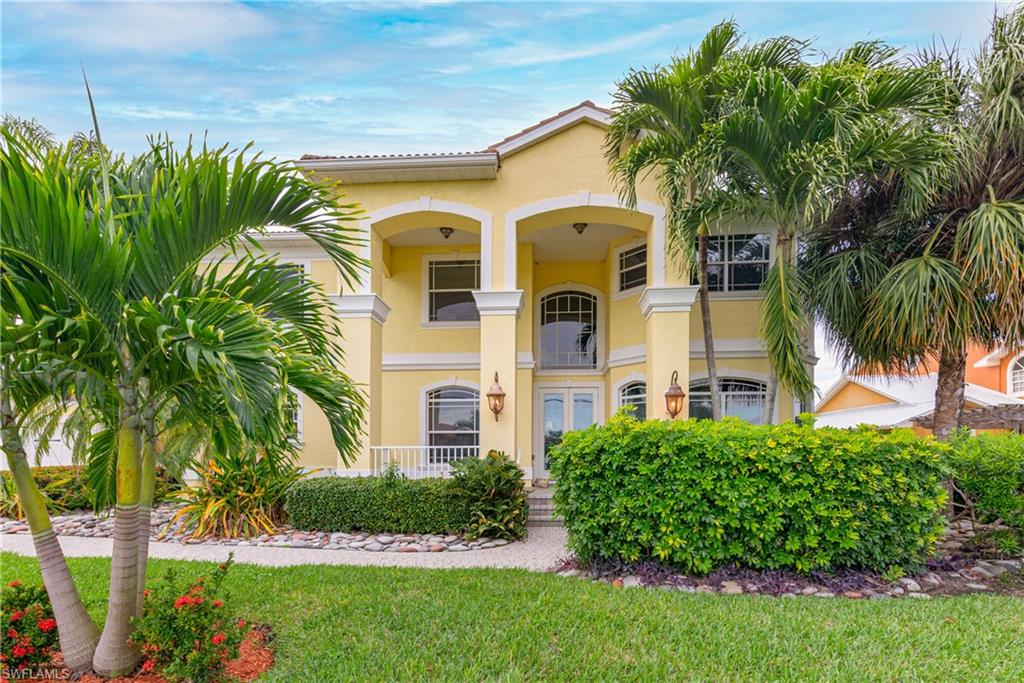 Caution! Oversize! This exceptional property sits on a huge triple lot in the stunning southwest of the Cape. On two spacious levels this beautiful Floridian house is just waiting for you to come and make it your own dream home. Inside you will find a separate formal dining room, a designated office area, a comfy living room, the first bedroom, and a bathroom with access to the pool area as well as a very spacious kitchen. The house is equipped with a private elevator that brings you to the second level where you find the gallery with a pool table and access to the balcony. Upstairs you will find four more bedrooms as well as two bathrooms. This home could soon be the perfect space for you, your family, friends, and or guests. The home is located right on the Southwest Spreader and has a western exposure - this not only means every Florida Boater's dream with fast access to the Gulf but also privacy and nature with its outstanding view of the nature preserve. The location also guarantees a front row seat to experience the most amazing sunsets, watching the sun set behind the Florida mangroves. There is a Boats dock already in place as well as a boat lift. Sitting on a triple lot which is very rare for a home like this in the area, this leaves an enormous amount of space for entertaining: in- and outside. As a bonus the house is currently in a vacation program and comes with the option of it staying that way if you want!