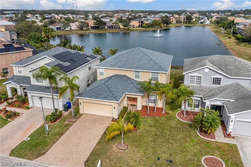 Embark on a journey of grandeur with this awe-inspiring 2-story residence, spanning over 3,260 sqft and featuring 5 generously-sized bedrooms and 3.5 lavishly appointed bathrooms. Positioned majestically on one of the most sought-after lots in the community, it offers mesmerizing views of a tranquil, expansive lake. Step inside, and the open layout beckons you into a capacious living room seamlessly merging with a kitchen that defines spacious dining-living areas. Downstairs, two bedrooms and 1.5 bathrooms provide convenience, while upstairs reveals 2 additional bedrooms, a master suite, and a sprawling den with a separate office/gaming room. Every bedroom boasts ample space and features jack and jill bathrooms, with the master suite showcasing an expansive walk-in closet and a screened patio. Adding to the allure, a brand-new roof installed in December 2023 ensures both style and substance. Conveniently located with easy access to the airport, major highways, upscale restaurants, shopping plazas, and retail stores, this home is poised and ready for its new owner. Seize the opportunity to make this haven yours – act now and indulge in the epitome of luxury living! LOW HOA fees!