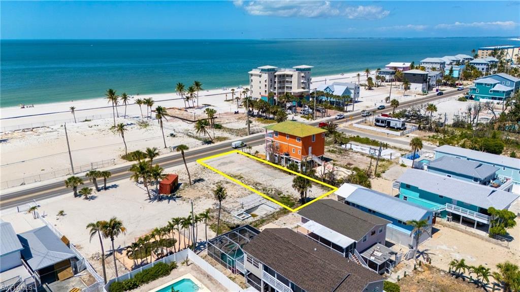 One or more photo(s) has been virtually staged, AI generated or rendered.  ELEVATED LIVING with SUNSETS GALORE! Welcome to 5525 Estero Boulevard—a rare chance to own in the hottest redevelopment zone in Florida. GULF VIEWS from this 45' x 125' vacant residential lot sitting along Fort Myers Beach’s iconic main corridor and offers a front-row seat to the island’s dramatic transformation. Just a short stroll to the sand via Beach Access #16 (Dakota Avenue), this parcel puts you within arm’s reach of the Gulf while offering deep dimensions rarely found this close to the beach. BUILD YOUR DREAM HOME. The lot previously held a duplex and now offers a clean slate for a stunning new build. BUILDER INTRODUCTIONS AVAILABLE + RENDERINGS - FLOOR PLANS. And here’s where it gets exciting: with 125 feet of depth, the outdoor space you can create is incredible. Picture a resort-style pool and spa, an open-air kitchen under a covered lanai, a custom putting green, cornhole court, firepit lounge, or even your own beachfront-inspired game zone. This is more than a lot—it’s a lifestyle platform. Utilities are available, walkability is outstanding, and redevelopment is surging all around you. Whether you’re building a private escape or a high-yield rental, this is the kind of opportunity that disappears fast. Bold location. Big potential. Endless outdoor living. Don’t just watch the Fort Myers Beach comeback—be a part of it.