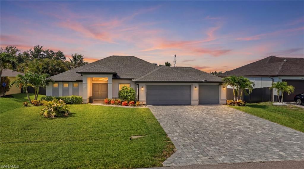 Rare opportunity to own a better than new 3CAR GARAGE pool home in a *NO FLOOD ZONE*!! Built in 2022, this beautifully maintained 3-bedroom + den, 2-bath residence CHECKS ALL THE BOXES buyers are wanting in a FL home!  Offers the perfect blend of modern coastal design, quality upgrades, and an unbeatable *SW Cape Coral location*. The bright, open-concept floor plan features upgraded tile throughout, tall ceilings, elegant plantation shutters, designer lighting, and upgraded ceiling fans. The spacious kitchen overlooks the main living area and is highlighted by a large granite island, stainless steel appliances, and ample cabinet space—ideal for everyday living and entertaining.

Den for home office, separate dining area, and laundry room leading out to the epoxy *3 CAR GARAGE*!

Step outside to your *SOUTH-FACING* screened pool, providing all-day sunshine and the perfect setting for relaxing or hosting guests. The covered lanai extends your living space year-round, while the landscaped backyard offers added privacy.

Additional highlights include *CITY WATER & SEWER, * impact-resistant construction including *IMPACT DOORS AND WINDOWS*, and the peace of mind that comes with a newer home. 
Conveniently located just minutes from Burnt Store Marina, shopping and dining along Pine Island Road, Farmer Joe's, golf courses, parks, and with easy access to Punta Gorda and Fort Myers.

Move-in ready and loaded with upgrades—this is the Florida lifestyle you've been waiting for! 
Realtors, please read confidential comments.