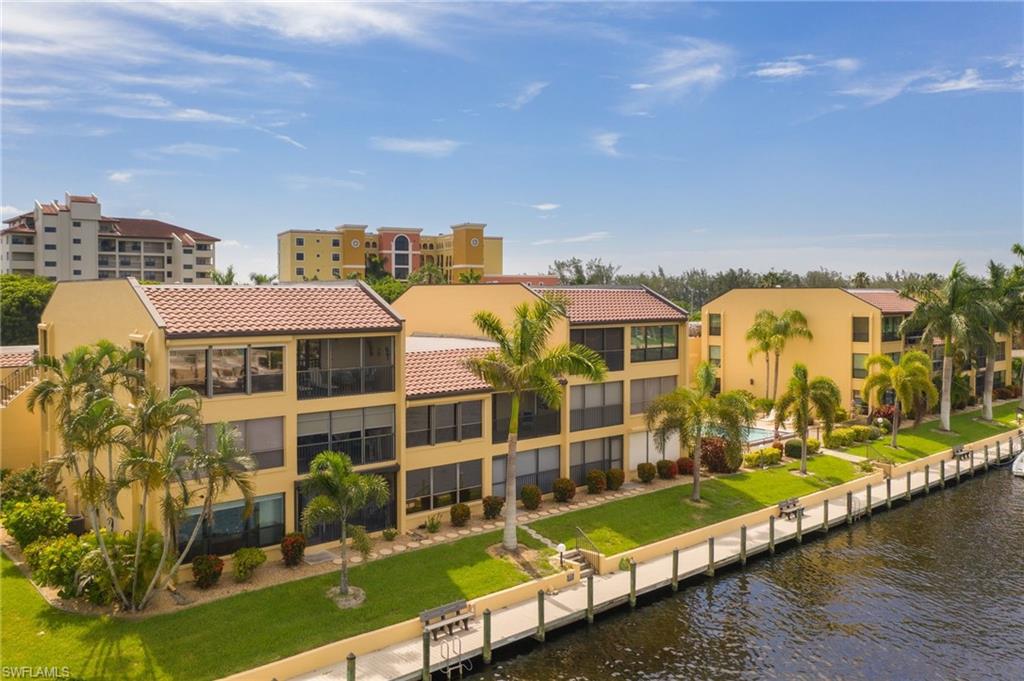 Totally Turnkey!  High End Furnishings (Sleep sofa and chair 3/2020 still has plastic on mattress.  A Gulf Access Condo like this doesn't come on the market often. Unique unit with no 3rd floor above. There are Electric hurricane Shutters for the huge wall of glass in the living room the rest of the windows and lanai have roll down shutters. New AC in 2019. New Dishwasher in April 2020. Guest Bathroom totally redone, Master Bath updated 2019 with raised ceiling and new shower and counters.  Window tinting 2019, new lanai screening 2018 and lanai has new tile flooring. Condo was repiped with an extra water shut off in the kitchen pantry. The Kitchen ceiling raised over one foot in kitchen and master bath.  Even the Popcorn ceilings are gone! Plantation shutters in dining room, and guest bedroom. The Master  and living room have upgraded Bali pull shades with a lining to keep heat out.  The garage is very deep which offers a lot of storage area.  This is a 55 property. one person must be 55+. Will Not Last!  Everything except for Personal Items will Stay! Non Smoking Complex