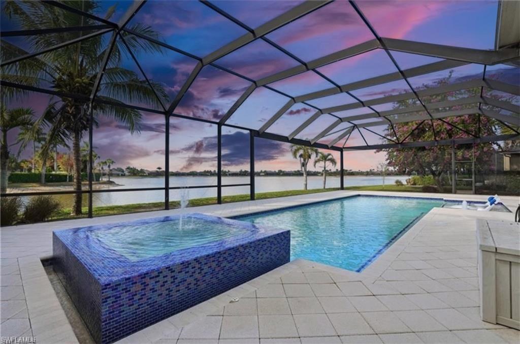 AVAILABLE SEASONALLY AT $15,000 PER MONTH! AVAILABLE NOW ANNUALLY FOR $8,000 PER MONTH! THIS PET FRIENDLY AND LARGEST POOL AND LANAI (OVER 5O FT) IN ALL OF NAPLES RESERVE CAN BE YOURS TODAY! Coastal contemporary OPEN FLOOR PLAN perfect for entertaining w/extraordinary lake view. WATERFRONT LOT on 125-acre lake w/opportunity to install a private BOAT DOCK. 4 beds, 3.5 baths, 3-car tandem garage. IMPACT GLASS WINDOWS. Custom heated SALTWATER pool/spa, NOSEEUM SCREENED LANAI with OUTDOOR KITCHEN. 12' ceilings throughout, wall to wall dual open sliders. TILE FLOORS, ceiling fans. GOURMET KITCHEN w/CUSTOM ITALIAN CABINETRY, huge island, QUARTZ COUNTERTOPS, upgraded stainless steel appliances, walk-in pantry. WINE BAR, BUTLERS PANTRY. Master bedroom w/beautiful lake view & French doors leading out to screened lanai. Master bath w/2 separate vanities, walk-in shower & 2 large WICs. Guest bedroom w/ensuite bath & 2 additional bedrooms w/Jack-n-Jill bath. Enjoy entertaining family and friends in this masterpiece of contemporary design with 4 BRs and 3.5 BAs and a w-i-d-e lake view. This Ashton Woods Majorca model boasts a great room layout with 12' ceilings, accentuated by wall-to-wall dual open sliders that seamlessly integrate indoor and outdoor living spaces. Tile floors complement the contemporary aesthetic, while new modern designer ceiling fans and light fixtures add elegance. The kitchen is a chef's dreamscape, featuring Cucine cabinetry with upper and lower LED lighting, sleek quartz countertops, high-end stainless steel appliances, a precision induction cooktop with wall-mounted pasta pot filler, and a large 15' custom island! Additional amenities include a walk-in pantry, a wine bar, quartz counters, and a separate butler's pantry/food prep counter. Retreat to the spacious primary suite with his and her walk-in closets, beautiful lake views, and French doors leading to the screened lanai. The large spa-worthy primary bath boasts Cucine cabinetry, custom mirrors, upgraded tile floors, two separate vanities, and a walk-in shower. This home also features an en-suite VIP guest bedroom and two additional bedrooms connected by a Jack-n-Jill bath, providing ample space for family and guests alike—all generously sized. Step outside to your private paradise, offering a custom heated saltwater pool and spa with a 360-degree waterfall, both controlled remotely for convenience. The expansive screened lanai includes a state-of-the-art outdoor kitchen with a Twin Eagle Grill, ice maker, multi-drawer refrigerator, and a zero-clearance sink. The lanai is also enhanced with UV protection and an LED lighting system. Enjoy peace of mind with impact glass windows and doors, a security system, and the convenience of the central vacuum system. Enjoy amenities that include a resort-style POOL, lap pool, DINING, dog parks, TENNIS, PICKLEBALL, children's PLAYGROUND, and more!