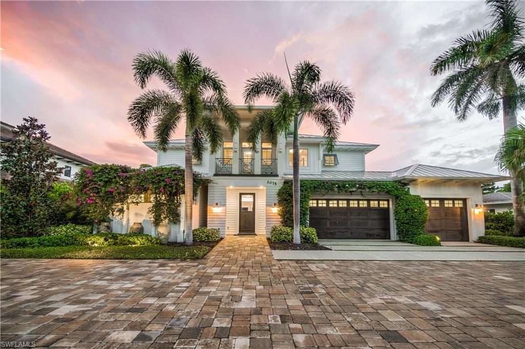 Sitting on one of Naples’ most enviable streets, 2075 Crayton Road in the exclusive Moorings neighborhood has just been listed. The four-bedroom plus den, six-bath (four full, two half), 4,190 square foot (under air) two-story single family home sits on a spacious interior lot with beautiful southwestern exposure and is just a short walk from the beach.The open-concept home remains like new. With a full chef’s kitchen, expansive island, gourmet Wolf and Subzero appliances, crisp all white custom cabinetry, any size party is effortless. The exquisite finishes and highest quality architectural and construction detail make this home ‘one of one.’ Wide-plank wood flooring throughout is complemented with occasional uses of marble and terrazzo, while spectacular overhead fixtures bathe the home in light. Meanwhile, the outdoor living area features a kitchen with island, fireplace and television just off the pool and spa (which also has a sun shelf and water feature). The home also features a large three-car garage and lush landscaping that makes you feel as though you are in a private tropical oasis.