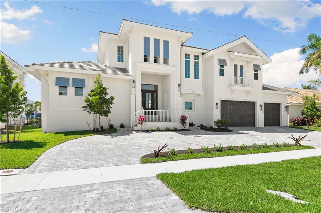 One or more photo(s) has been virtually staged, AI generated or rendered.  Paradise is calling—and this newly completed coastal masterpiece answers in style. Built by the esteemed Frey & Son Homes, this exceptional residence sets itself apart with bespoke, high-end finishes that far exceed standard builder-grade construction.

Ideally located just 0.6 miles from Marco Island’s iconic crescent beach, the home offers effortless access to fine dining, boutique shopping, and vibrant local entertainment—putting the very best of island living at your doorstep.

Designed with both comfort and sophistication in mind, the thoughtfully crafted floor plan features an expansive open-concept main level, perfect for seamless everyday living and entertaining. A spacious second-floor family room adds flexibility, creating an ideal space for hosting guests, accommodating extended family, or enjoying a private retreat.

Boating enthusiasts will appreciate the direct Gulf access with no bridges, a newer seawall (2023), and approximately 150 feet of wide canal frontage—offering stunning water views and ample room to design a custom dock and lift configuration.

With coveted west-southwest exposure, the property delivers unforgettable sunset views from your private lanai each evening. Embrace the Marco Island lifestyle: leisurely afternoons at waterfront cafés, and sunset cruises—all from the comfort of your own waterfront sanctuary.
