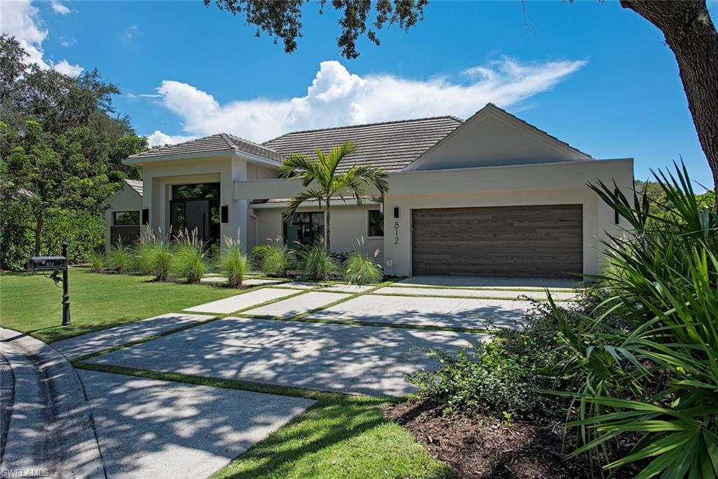 Great location. Easy access to shopping and dining. This property was completely renovated by Hlevel and built by BellaMia in sought after Pelican Bay. No detail was overlooked showcasing modern design and decor throughout, high-end finishes showcasing European Oak wood flooring, and an open floor plan that flows seamlessly from the interior to exterior living spaces. This desirable residence is an entertainer's dream featuring a chef’s kitchen with imported Italian cabinetry, top of the line Jennair, Bosch and Miele appliances with built in coffee maker and wine system. Take full advantage of the Florida lifestyle with expansive outdoor living area including a custom, resort style, heated, salt water pool and spa with jets, LED lighting and marble decking. The backyard is completed with artificial turf and your very own putting green! Residence is finished with upgraded plumbing system, newer HVAC, electrical wiring, and roof.