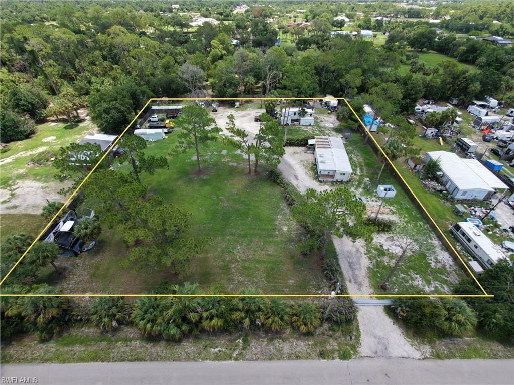 Exceptional income-producing opportunity on approximately 1.7 fully fenced acres in Suncoast Estates. This unique property features a manufactured home and multiple income-generating areas that are currently leased, creating an attractive opportunity for investors or buyers seeking a property with established cash flow.

The property has been configured into multiple rental sections, including residential occupancy, designated spaces for manufactured homes, vehicle and equipment storage, and an area currently used for livestock. With several independent income sources, the current configuration offers the potential to generate gross monthly income exceeding $10,000.

A significant added value is that approximately one-half acre of the property remains available for future development, offering the potential to build an additional residence or further enhance the property's utility, subject to buyer verification of all zoning, permitting, and county requirements.

The entire parcel is fully fenced, providing security, privacy, and flexible access throughout the property. Its versatile layout offers a variety of potential uses, whether continuing the existing income-producing setup or reconfiguring the property to suit the buyer's future plans.

This is a rare opportunity to acquire a large acreage property with multiple existing revenue streams and future development potential in the rapidly growing Suncoast Estates area. Motivated seller.